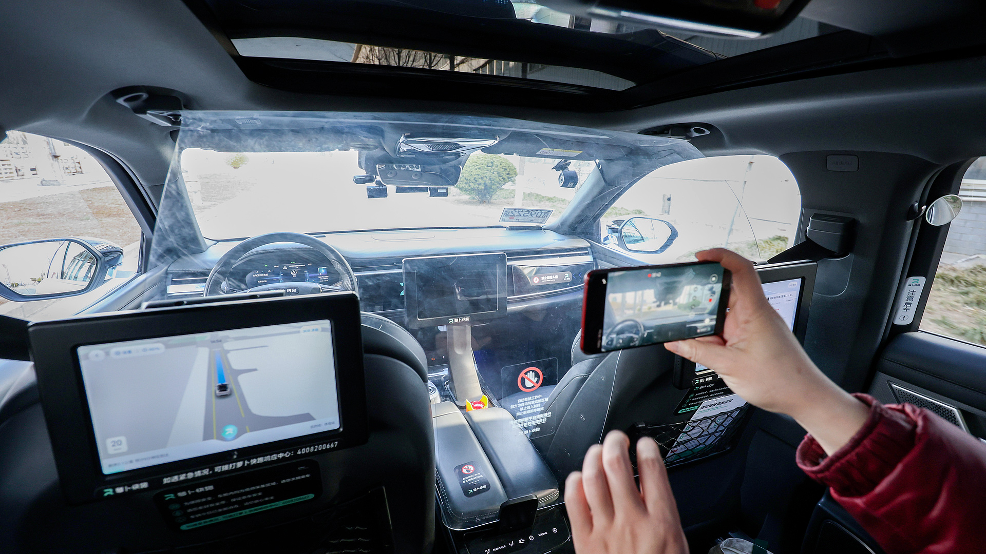 A self-driving car is driving along the road in Beijing, China. /VCG Photo