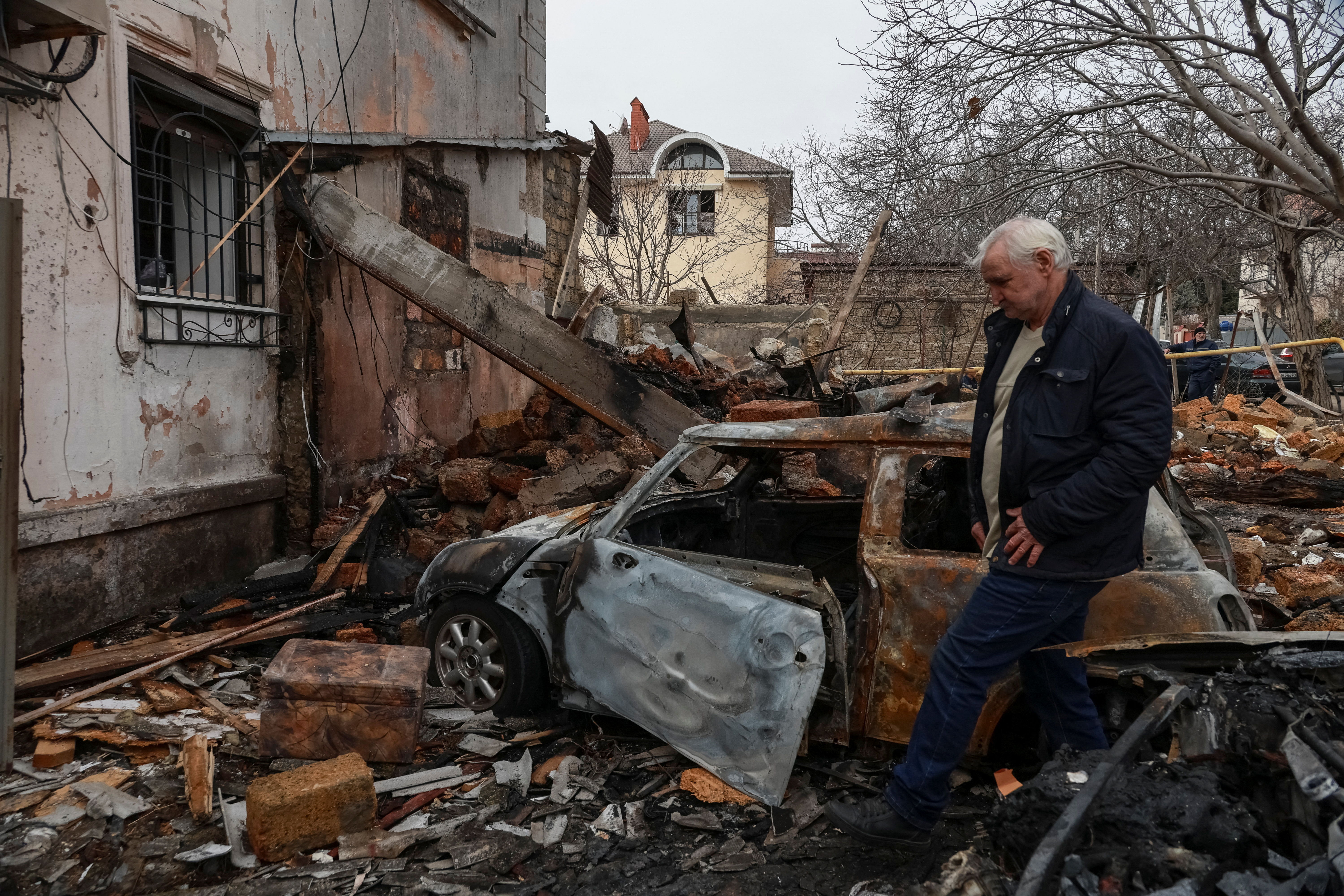 A resident is seen at a site of an apartment building hit by a Russian drone strike, amid Russia's attack on Ukraine, in Odesa, Ukraine on March 4. /Nina Liashonok/Reuters