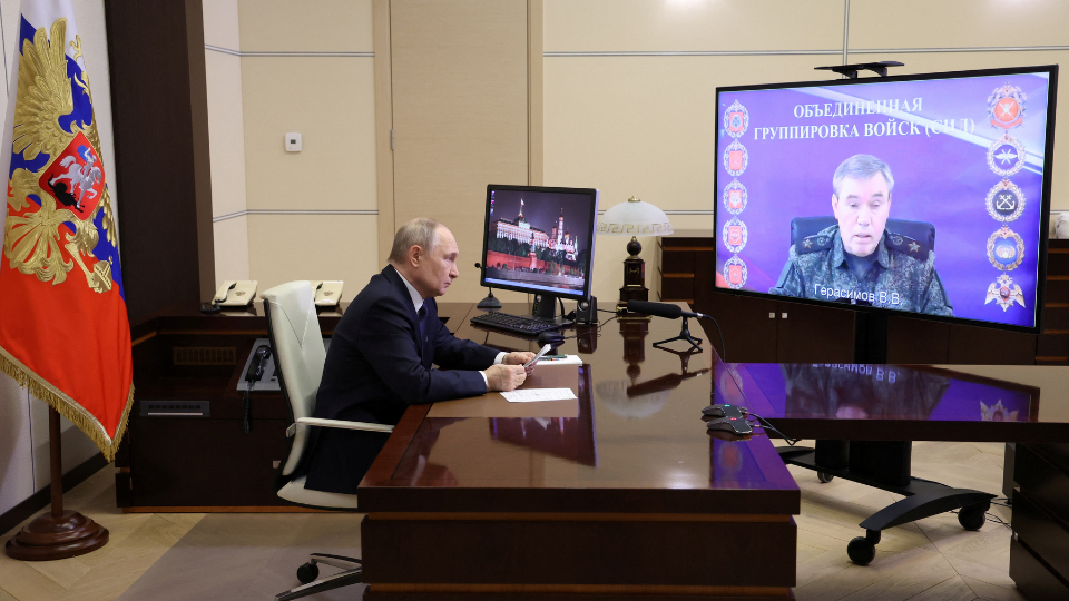 Vladimir Putin listens to a report of Chief of the General Staff of Russian Armed Forces Valery Gerasimov. /Sputnik/Alexander Kazakov/Pool via REUTERS