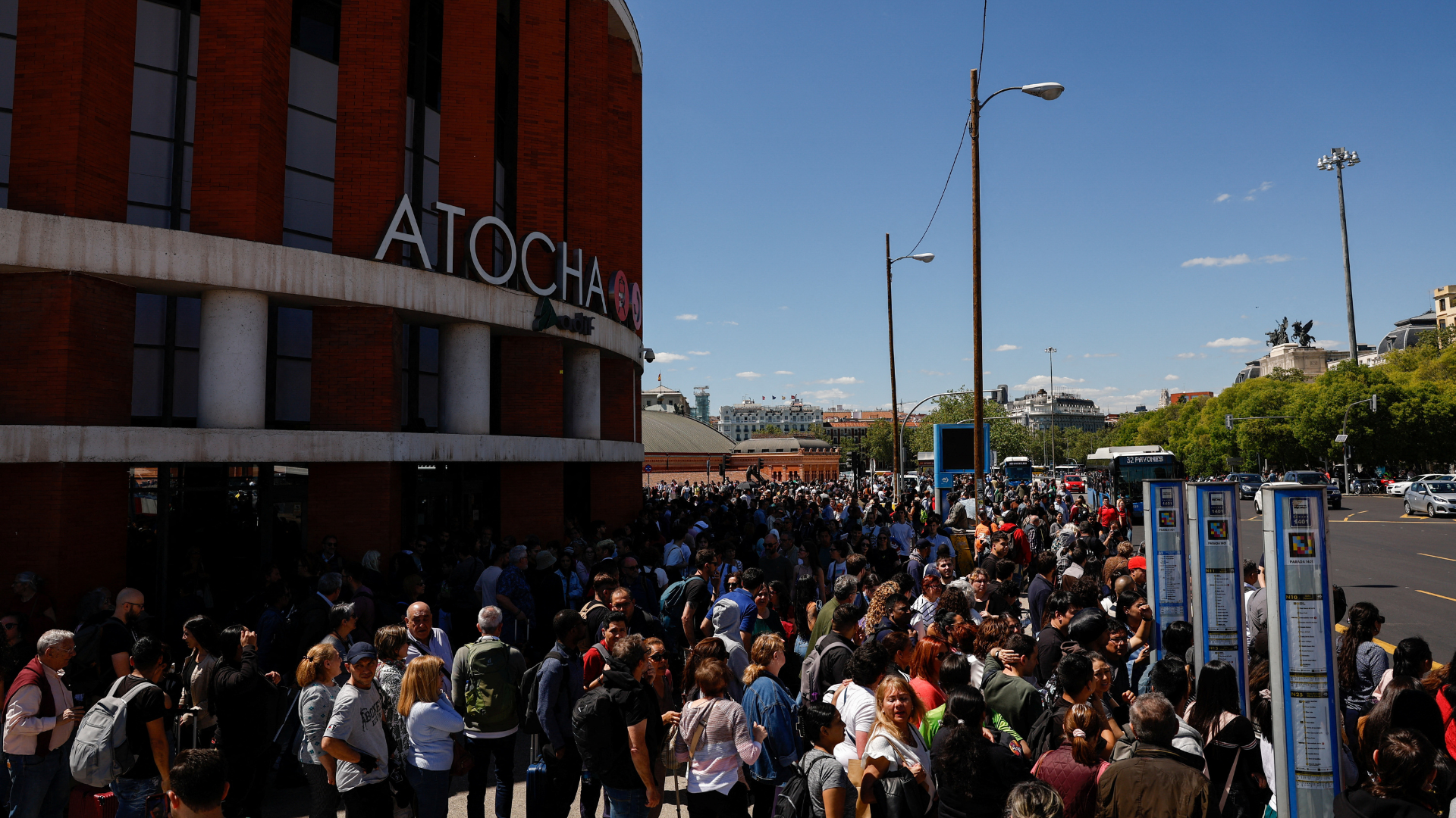 Travellers gather outside Atocha train station after it was closed due to a power outage in Madrid, Spain, April 28, 2025. /REUTERS/Susana Vera
