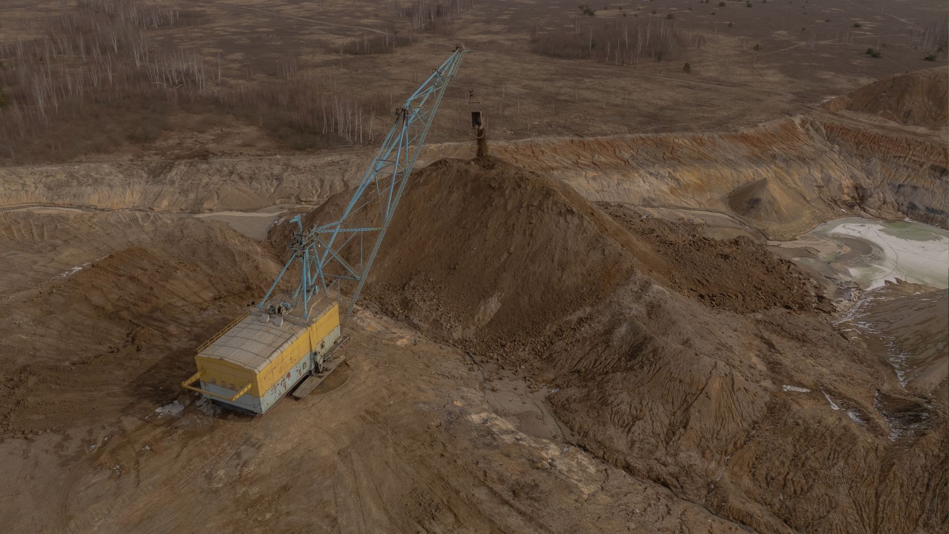 An aerial view shows a dragline excavator operating in an open-pit titanium mine in the Zhytomyr region, in February 2025. /Roman Pilipey/AFP
