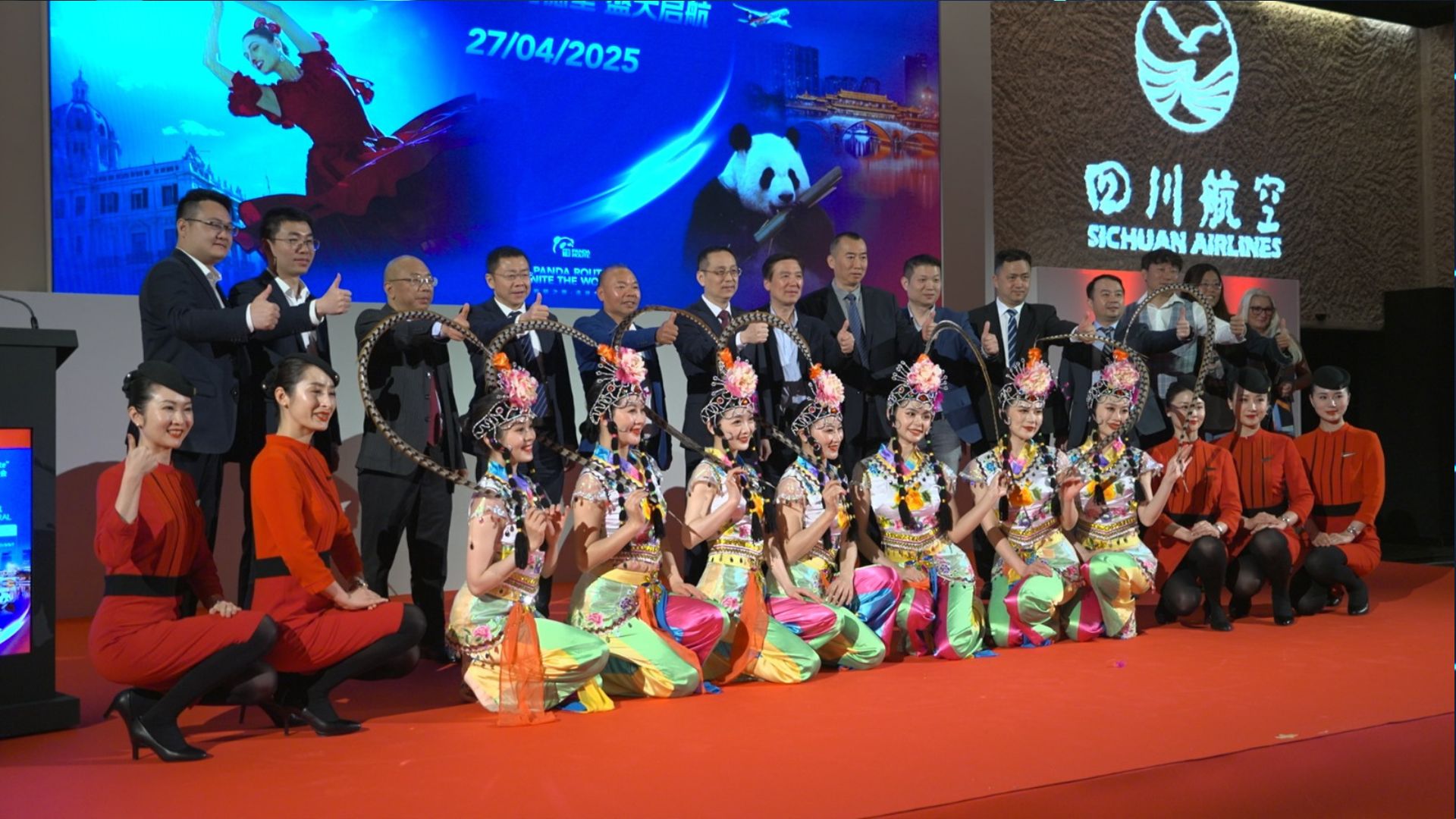 Sichuan Airlines officials and traditional dancers at the official launch in Madrid on April 28. /CGTN