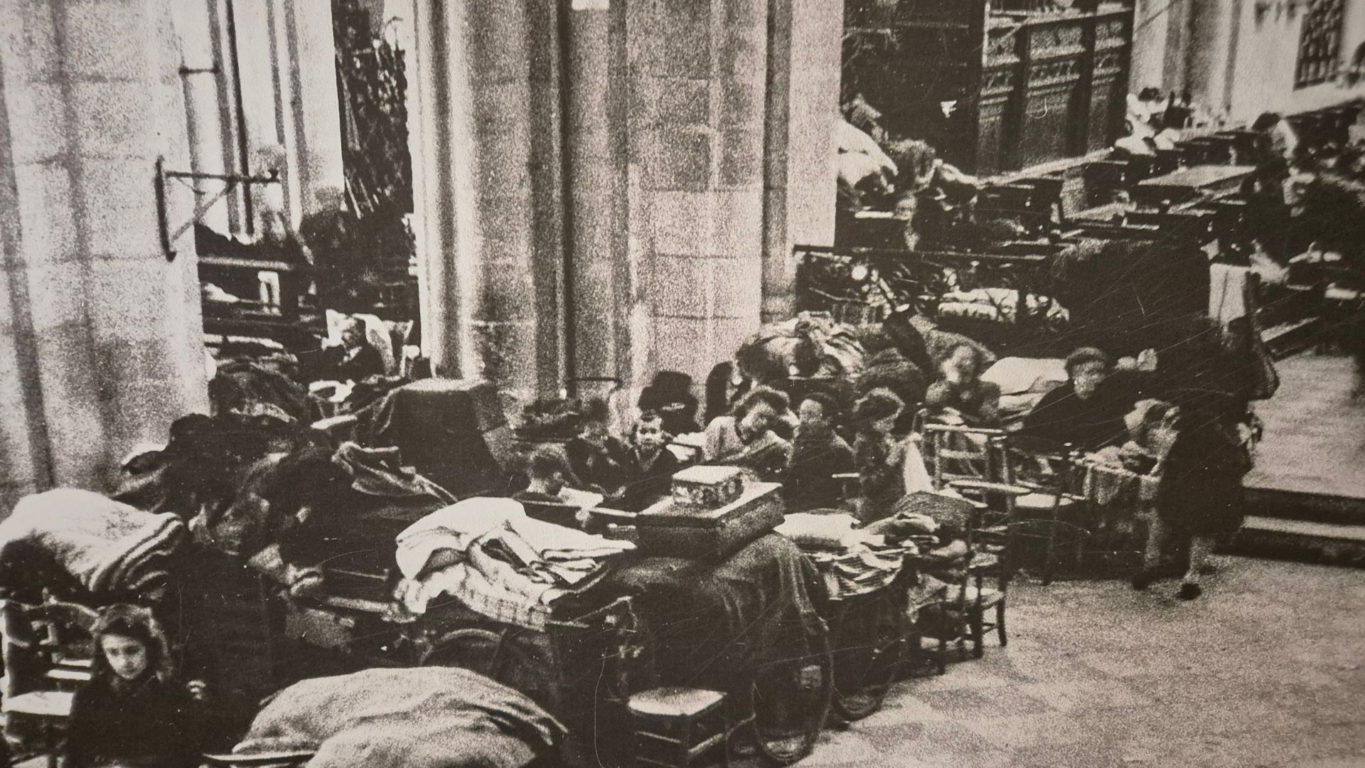 Civilians shelter in the abbey at Caen. /Memorial de Caen
