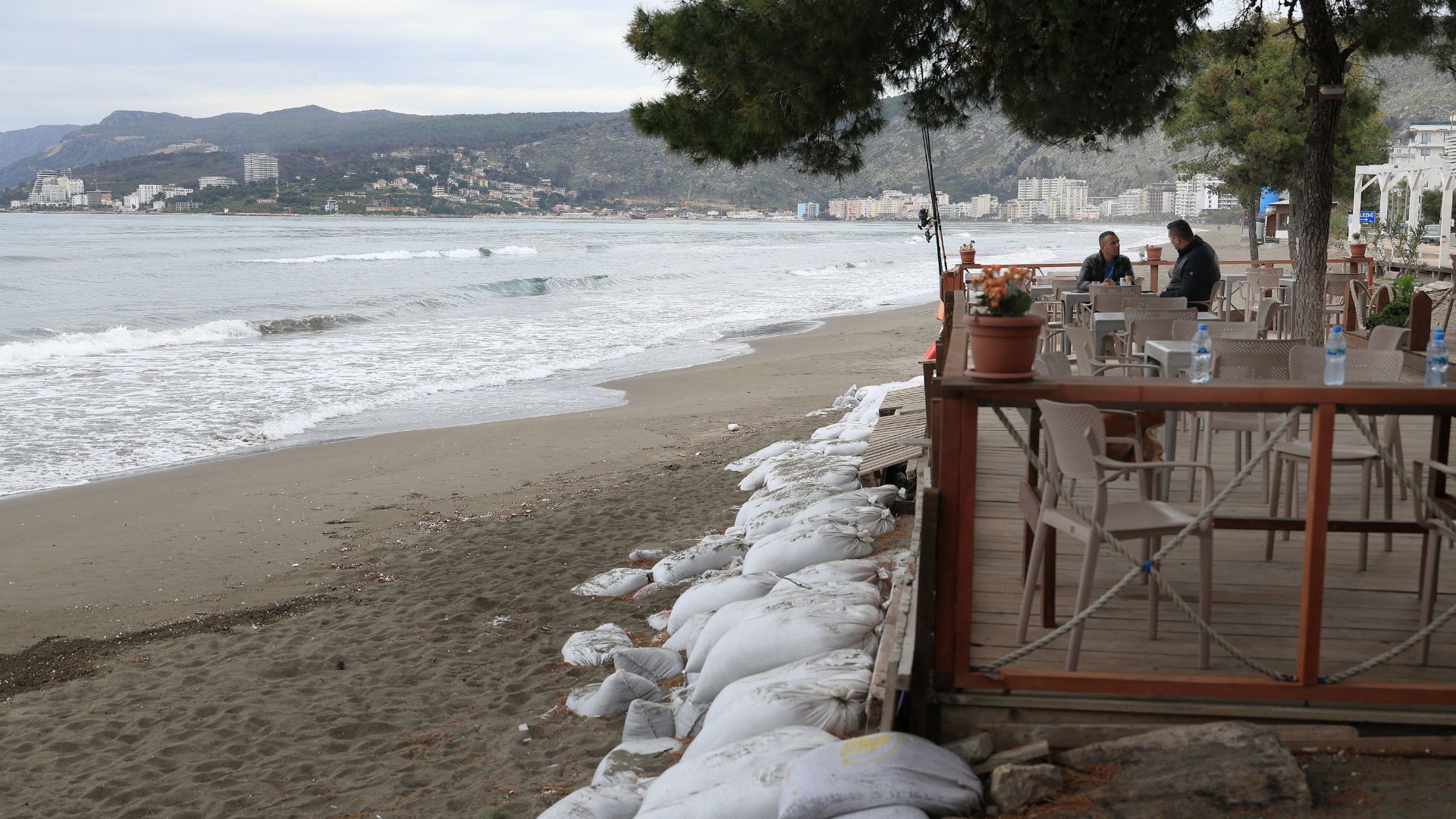 Sandbags are displayed near a bar on the coast of Kune, near the city of Lezhe, as rising tides have nibbled away more than half of Albania's coastline. /Adnan Beci/AFP
