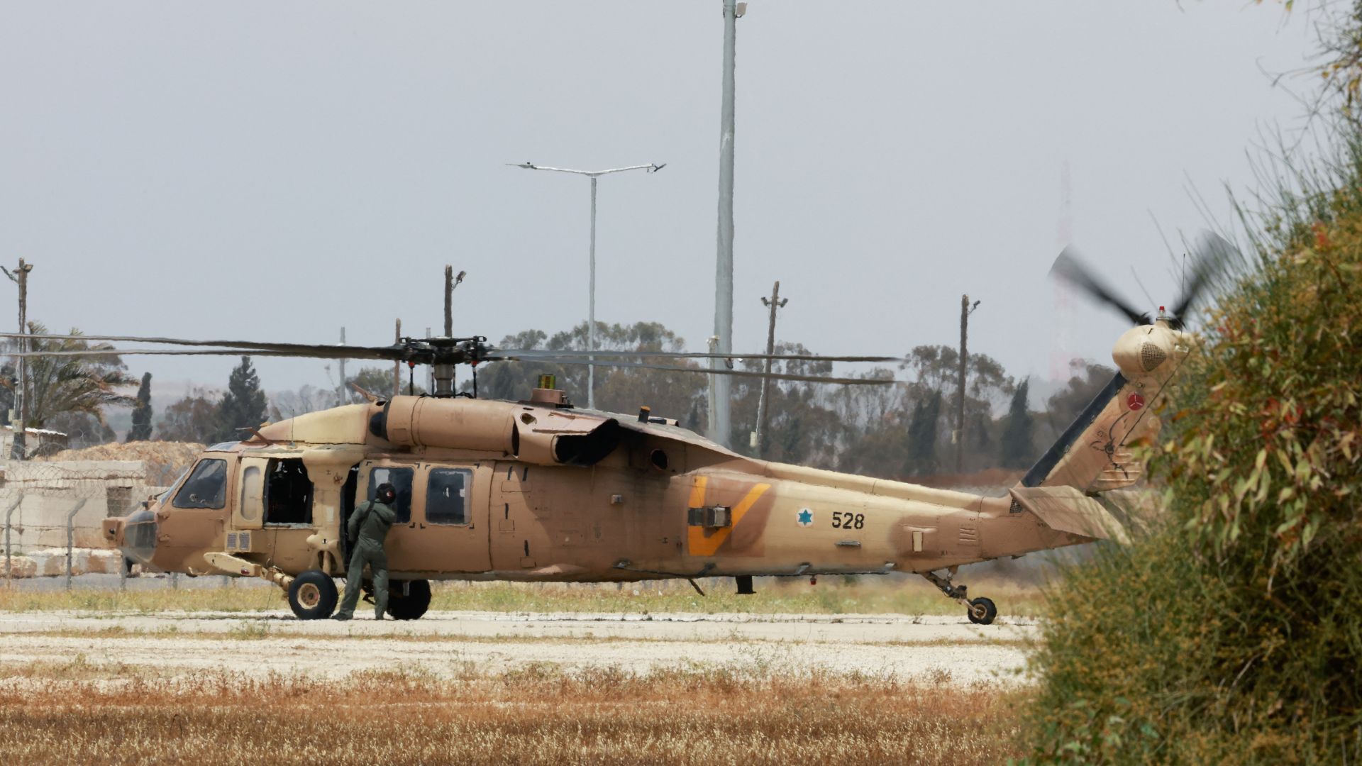 An Israeli military helicopter in Reim, Israel. /Ammar Awad/Reuters