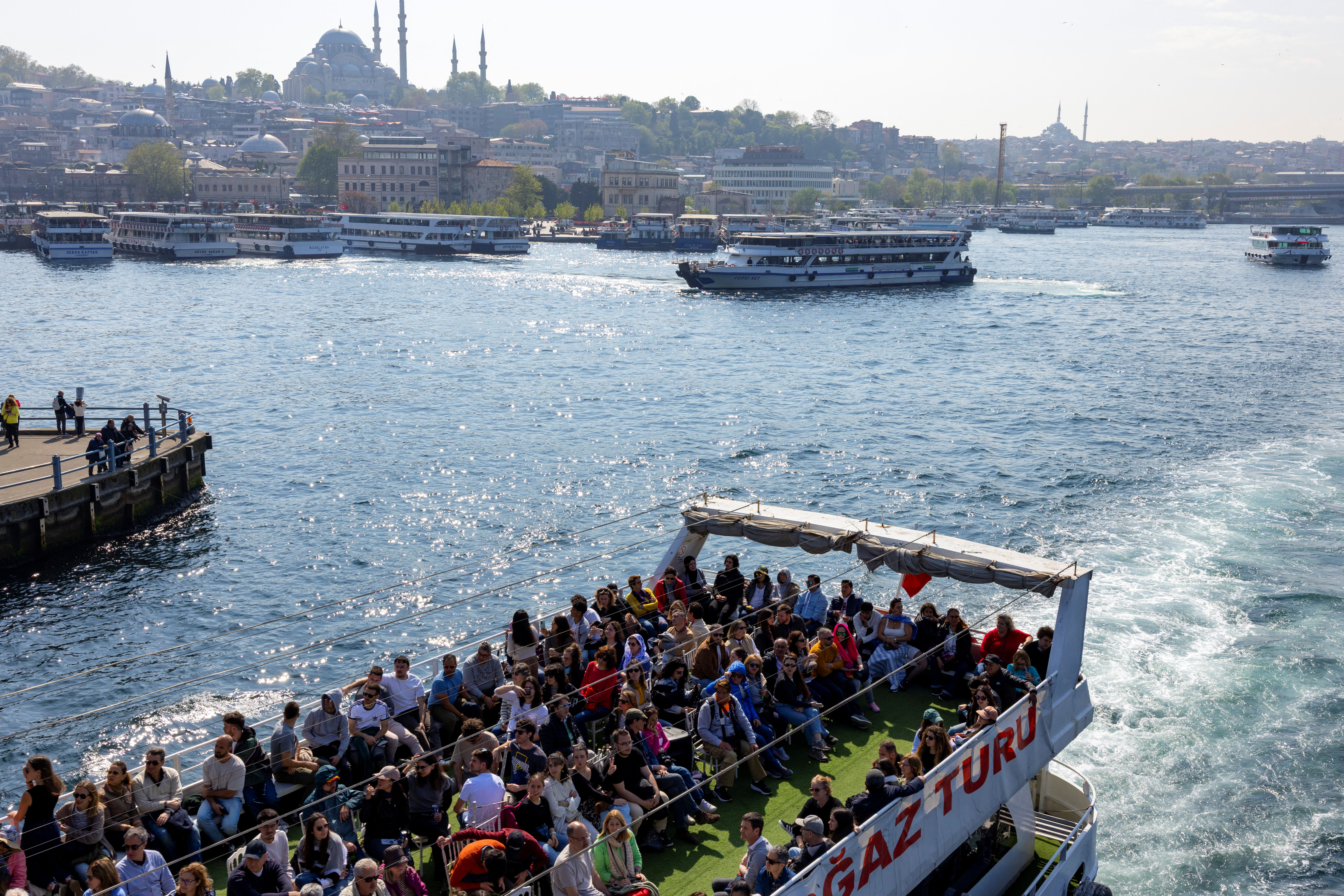 Tourists sail through Bosphorus in Istanbul, in April 25. /Umit Bektas/Reuters