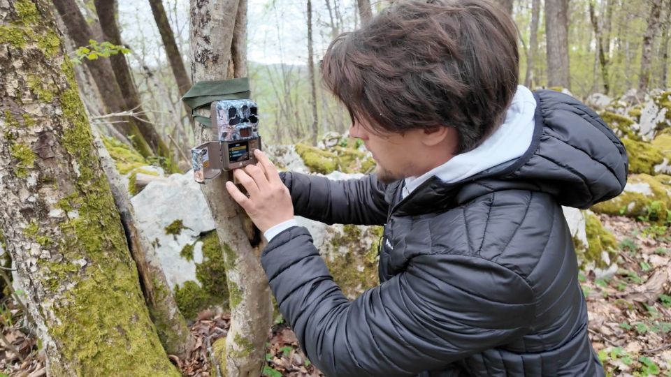 A local forest patrol monitor a camera that records wildlife activity. /CGTN