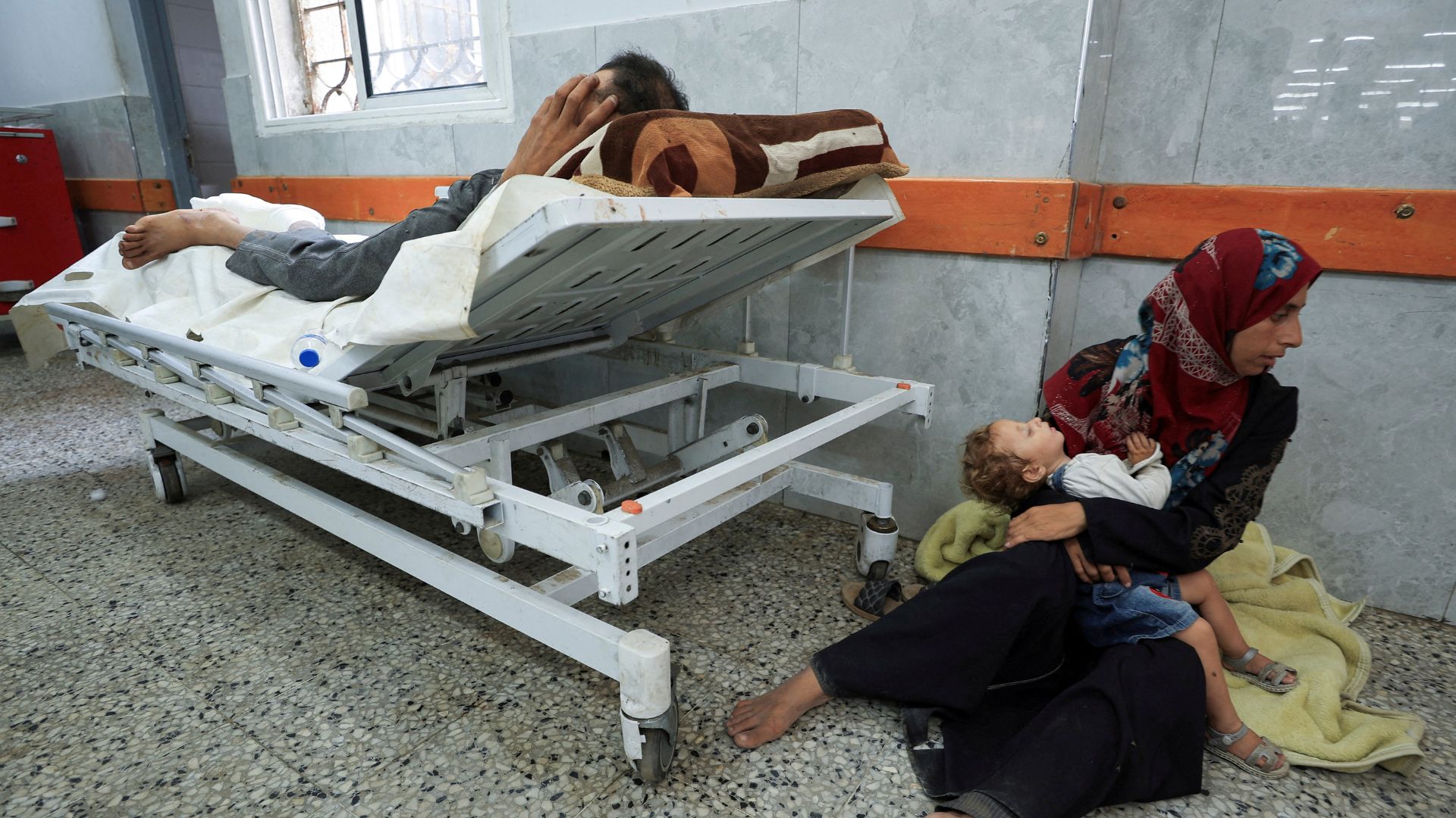 A Palestinian wounded in Israeli fire near an aid distribution center in central Gaza, according to medics, lies at Al-Shifa hospital, in Gaza City on June 11. /Dawoud Abu Alkas/Reuters