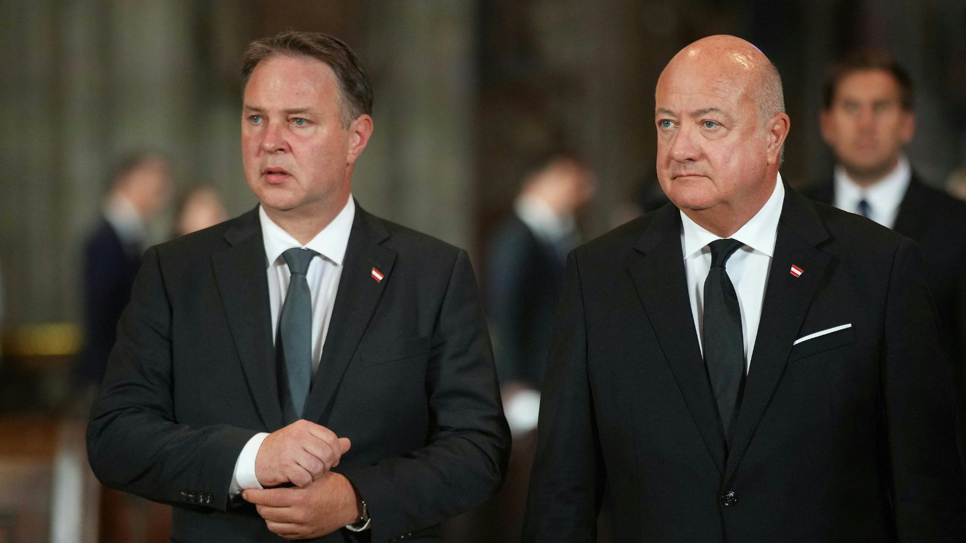 Austrian Chancellor Christian Stocker (R) and Austrian Vice-Chancellor Andreas Babler attend a memorial service in Vienna for those killed in the Graz school shooting. /Georg Hochmuth/APA/AFP
