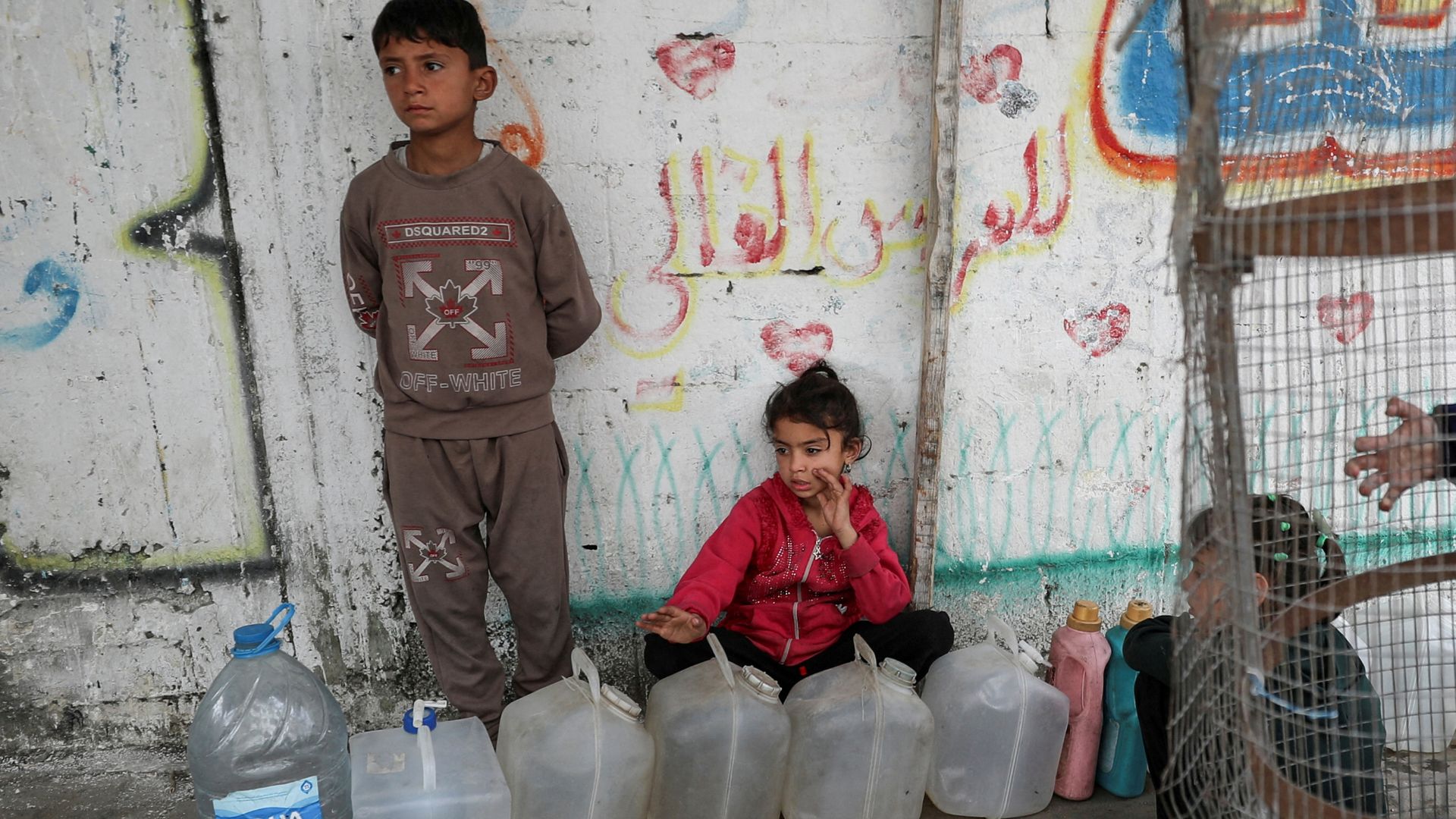 Palestinian children with water containers in Gaza City. /Mahmoud Issa/Reuters