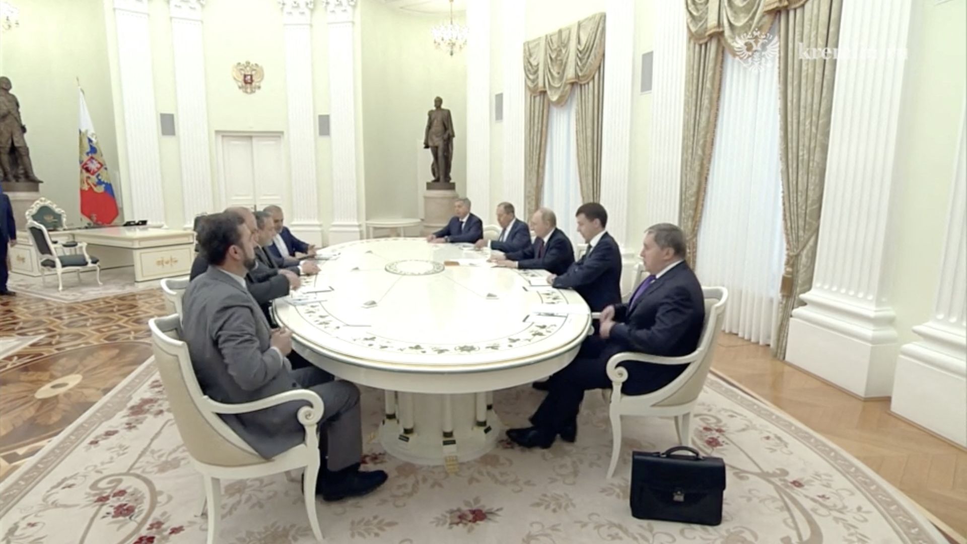 Putin, Araghchi and colleagues attend a meeting in Moscow. /Kremlin handout via Reuters