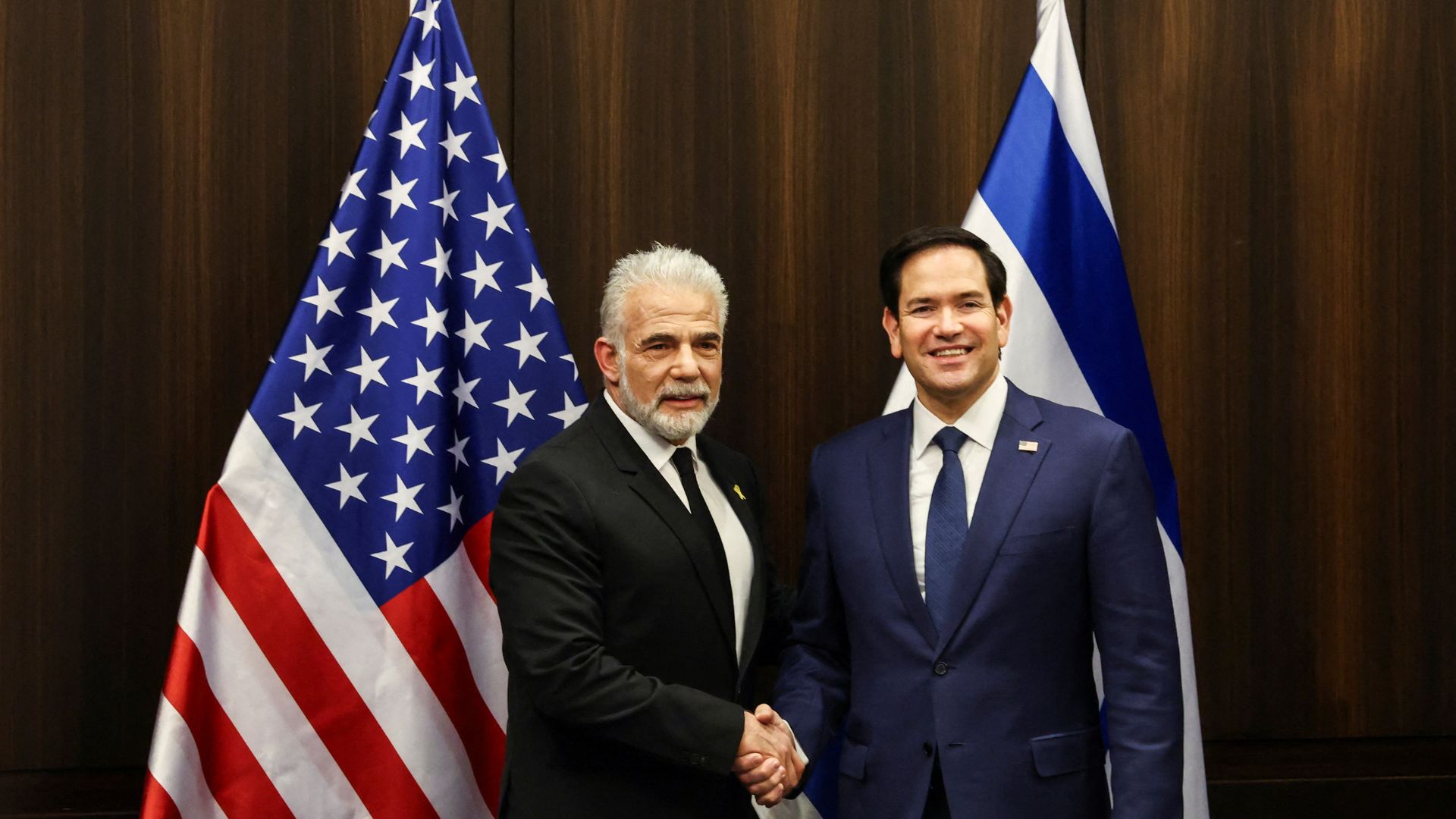 Israeli opposition leader Yair Lapid (left), seen with U.S. Secretary of State Marco Rubio, has offered Netanyahu's government a parliamentary safety net. /Evelyn Hockstein/Pool
