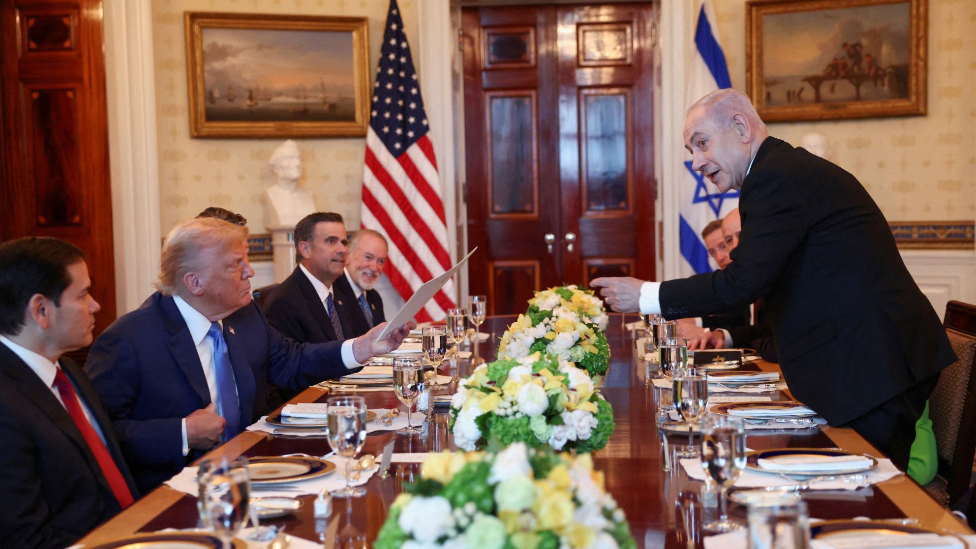 U.S. President Donald Trump receives a nomination letter after Israeli Prime Minister Benjamin Netanyahu told him he nominated him for the Nobel Peace Prize. /Kevin Lamarque/Reuters