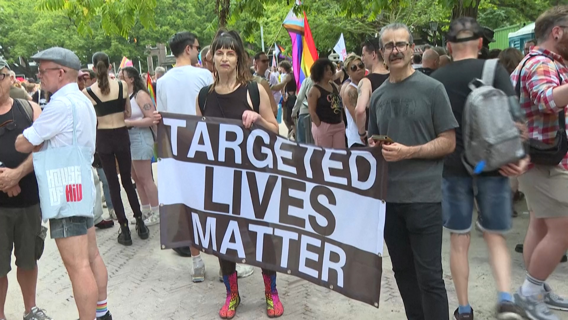 Protest banner at Amsterdam Pride, July 2025. /AFP