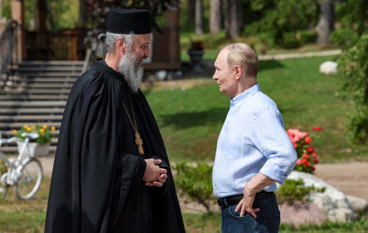 Russian President Vladimir Putin listens to a clergyman as he visits the Valaam Monastery in the Republic of Karelia, Russia August 1, 2025. /VIA REUTERS