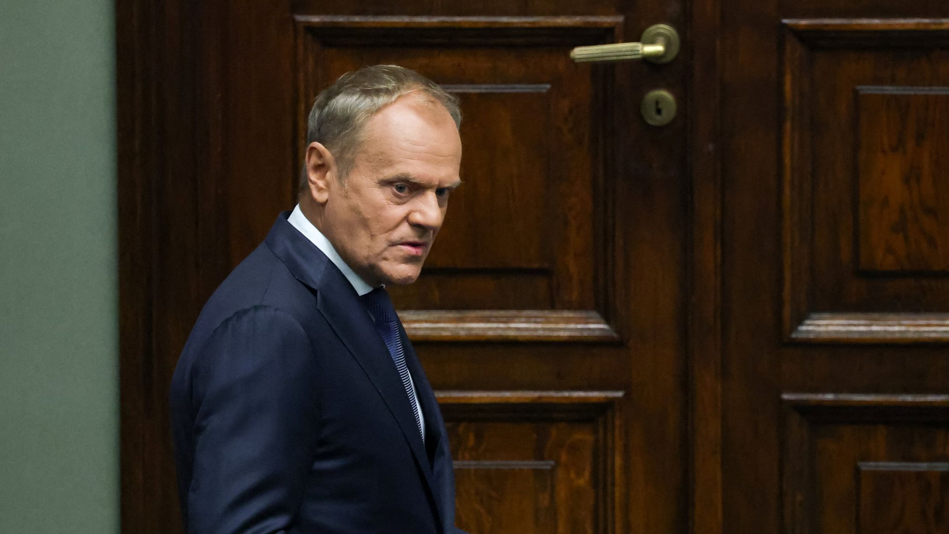 Poland's Prime Minister Donald Tusk looks on before the swearing-in ceremony of Nawrocki. /Kacper Pempel/Reuters
