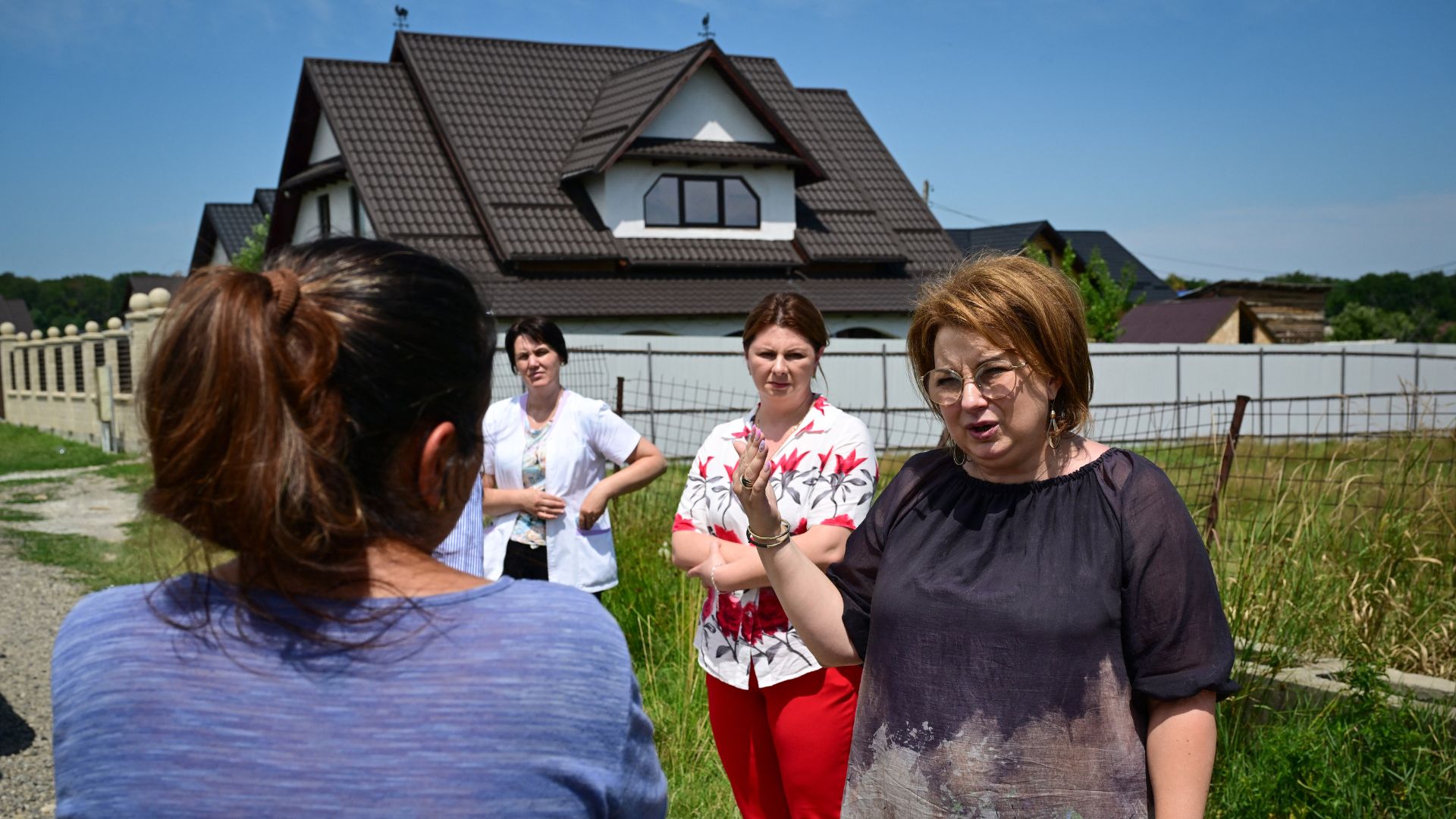 Gafita (R) has redoubled her efforts as the measles outbreak has worsened. /Daniel Mihailescu/AFP