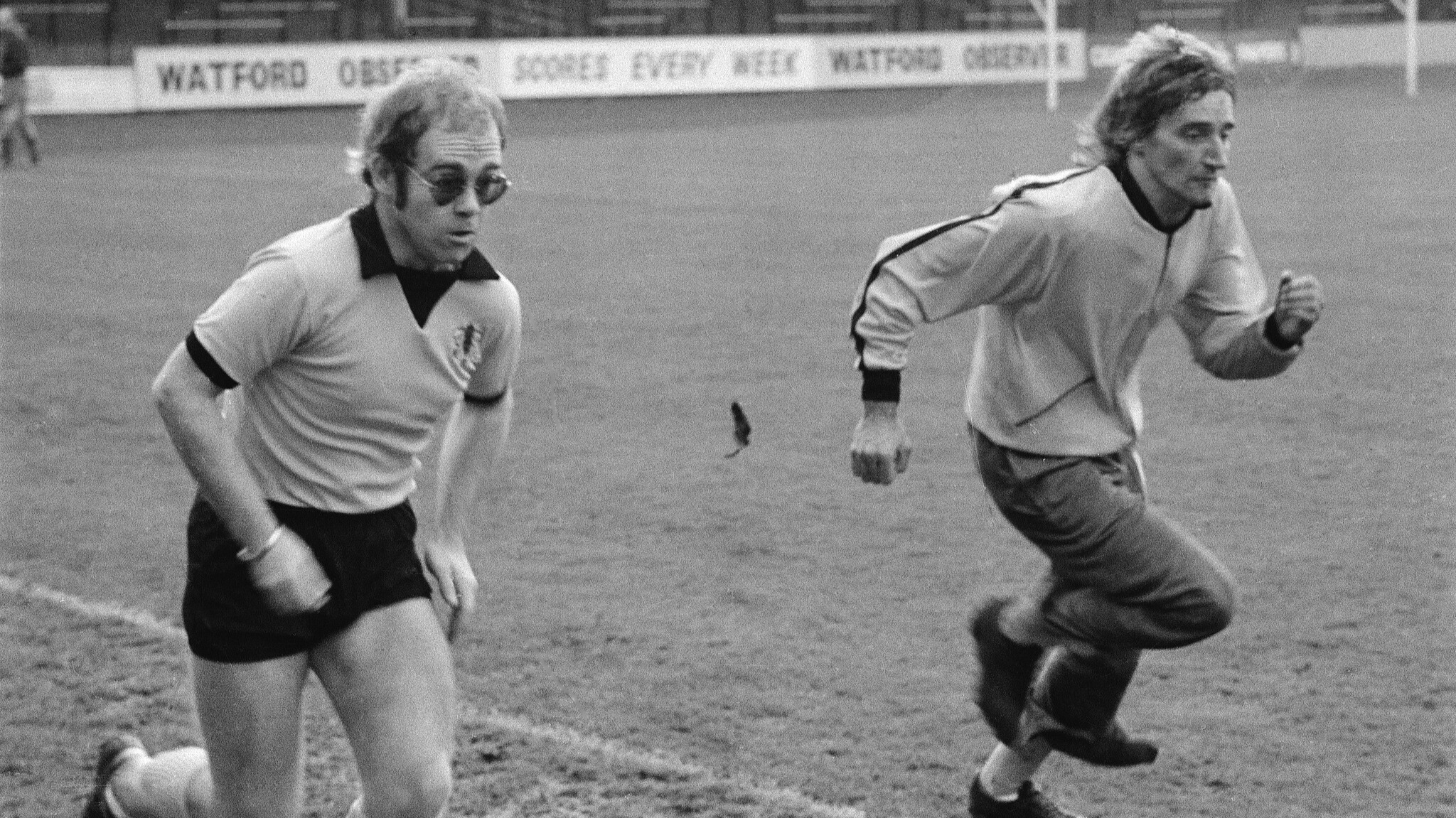 British singers Elton John and Rod Stewart training at Watford Football Club in the 1970s. /Michael Putland/Getty Images

