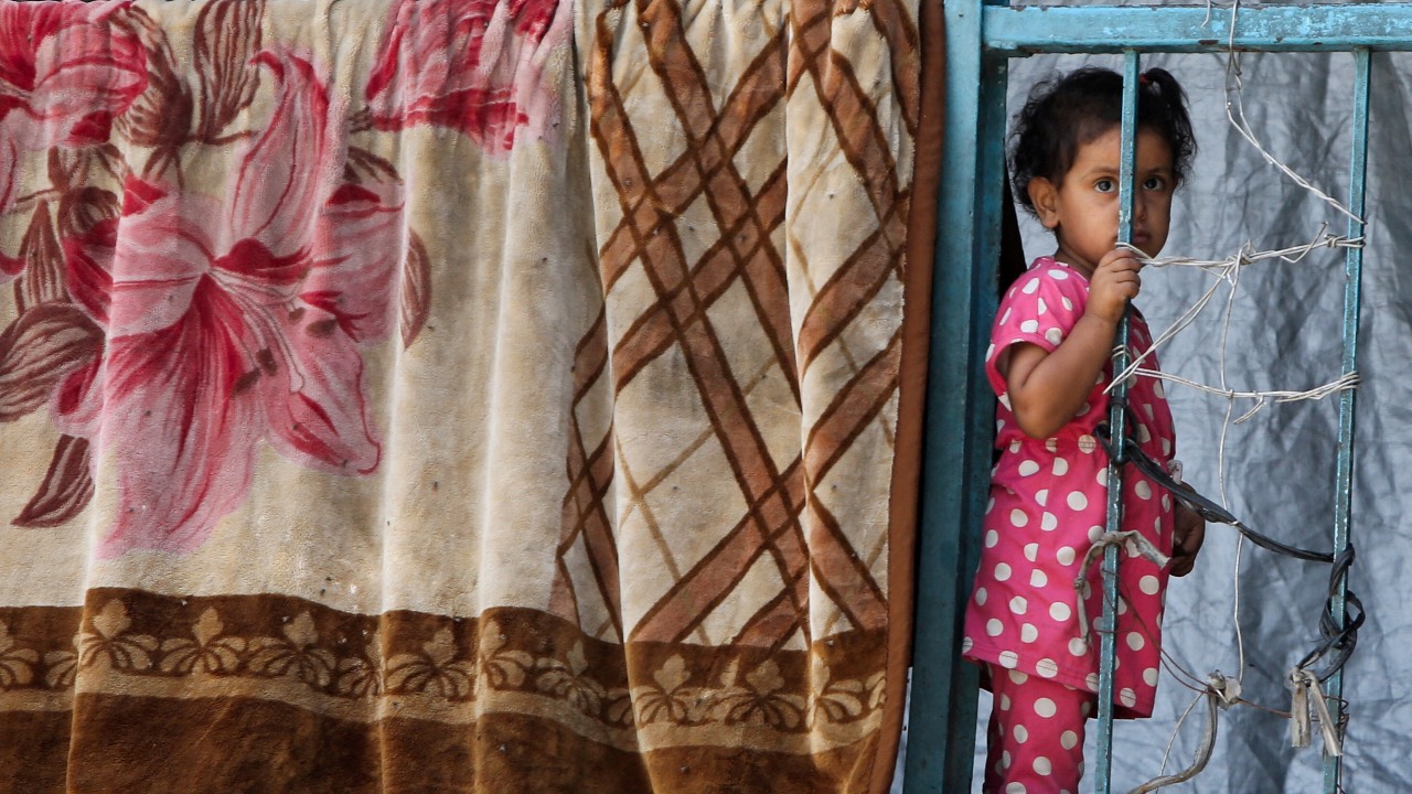 A Palestinian child, displaced by the Israeli military offensive, shelters in an UNRWA school, in Khan Younis, in the southern Gaza Strip. /Hatem Khaled/Reuters