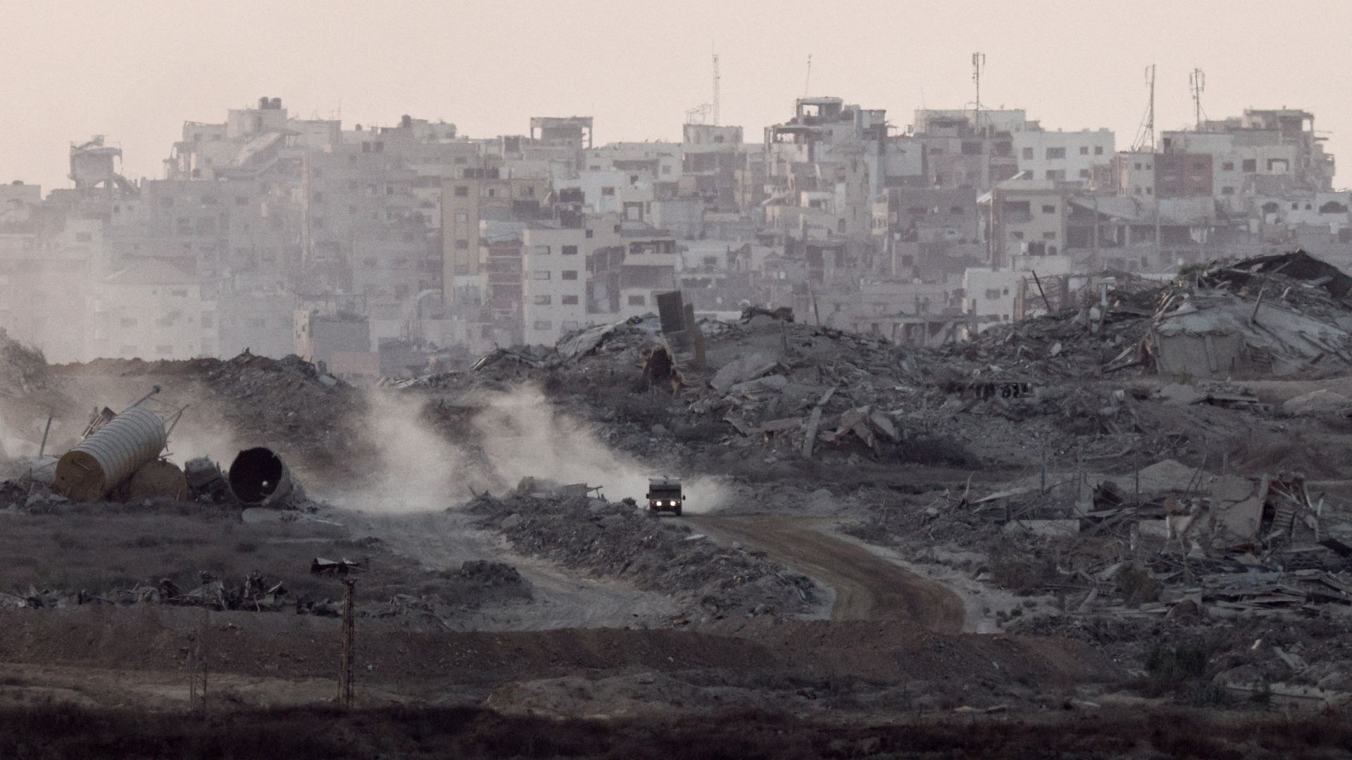 A military vehicle maneuvers in Gaza, as seen from the Israeli side of the border, on August 28. /Amir Cohen/Reuters