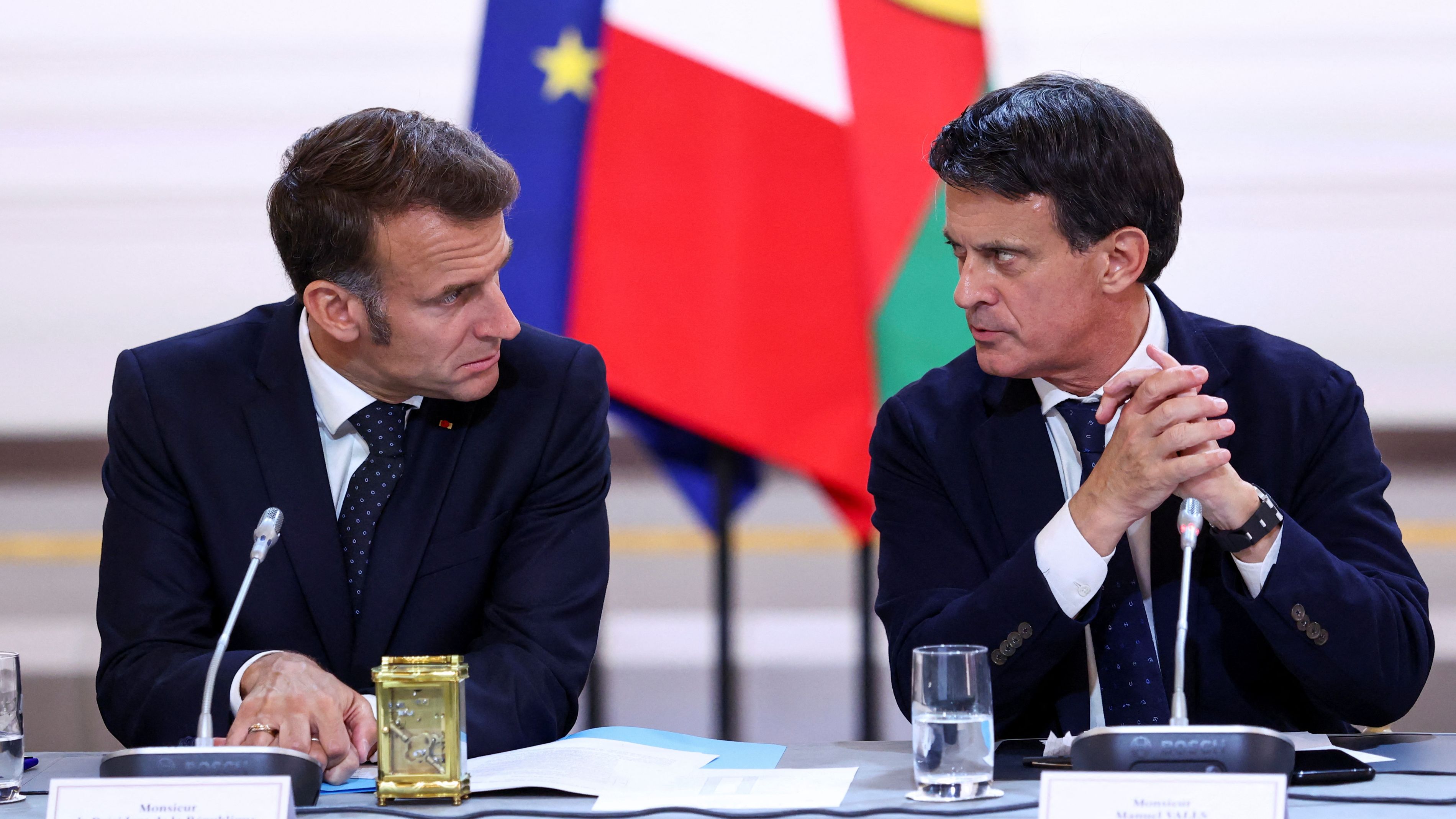 Current President Emmanuel Macron and Manuel Valls, prime minister between 2014 and 2016./ Tom Nicholson/Reuters 