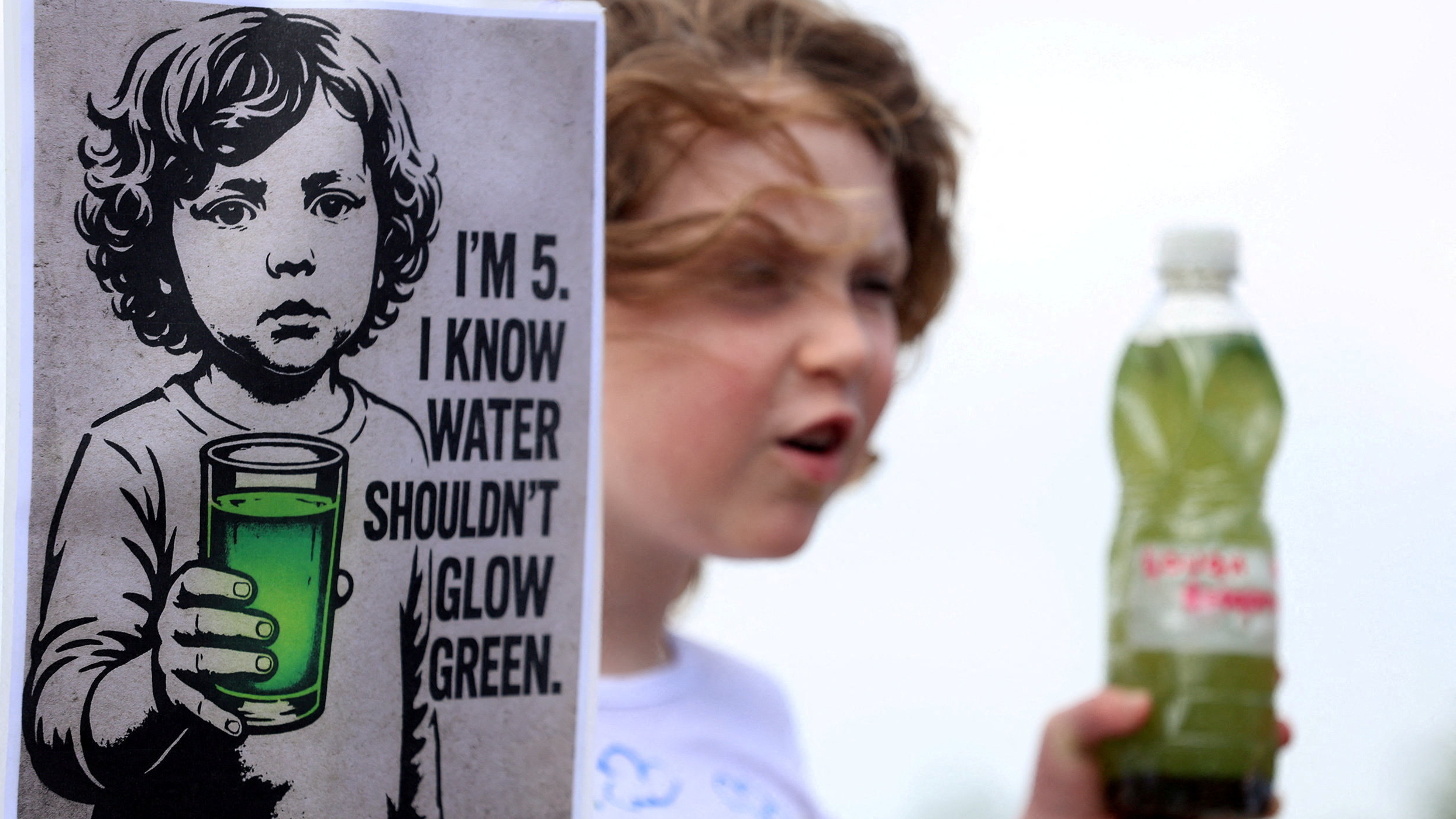 A girl joins members of the Save Lough Neagh group for a 'Rally for the Lough' in Northern Ireland in August. /Cathal McNaughton/Reuters 