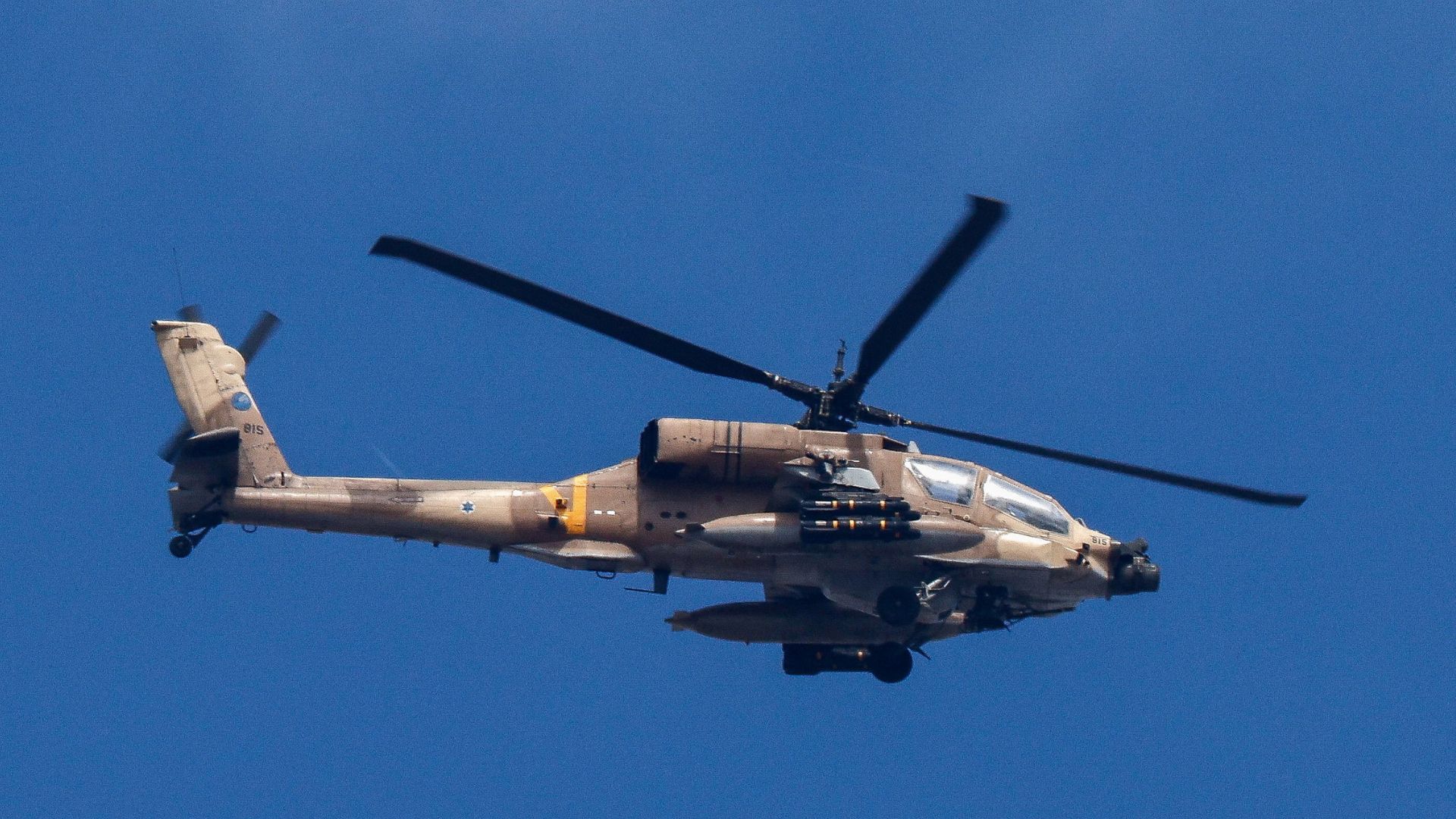 An Israeli Apache military helicopter flies over Gaza, as seen from Israel on September. /Amir Cohen/Reuters

