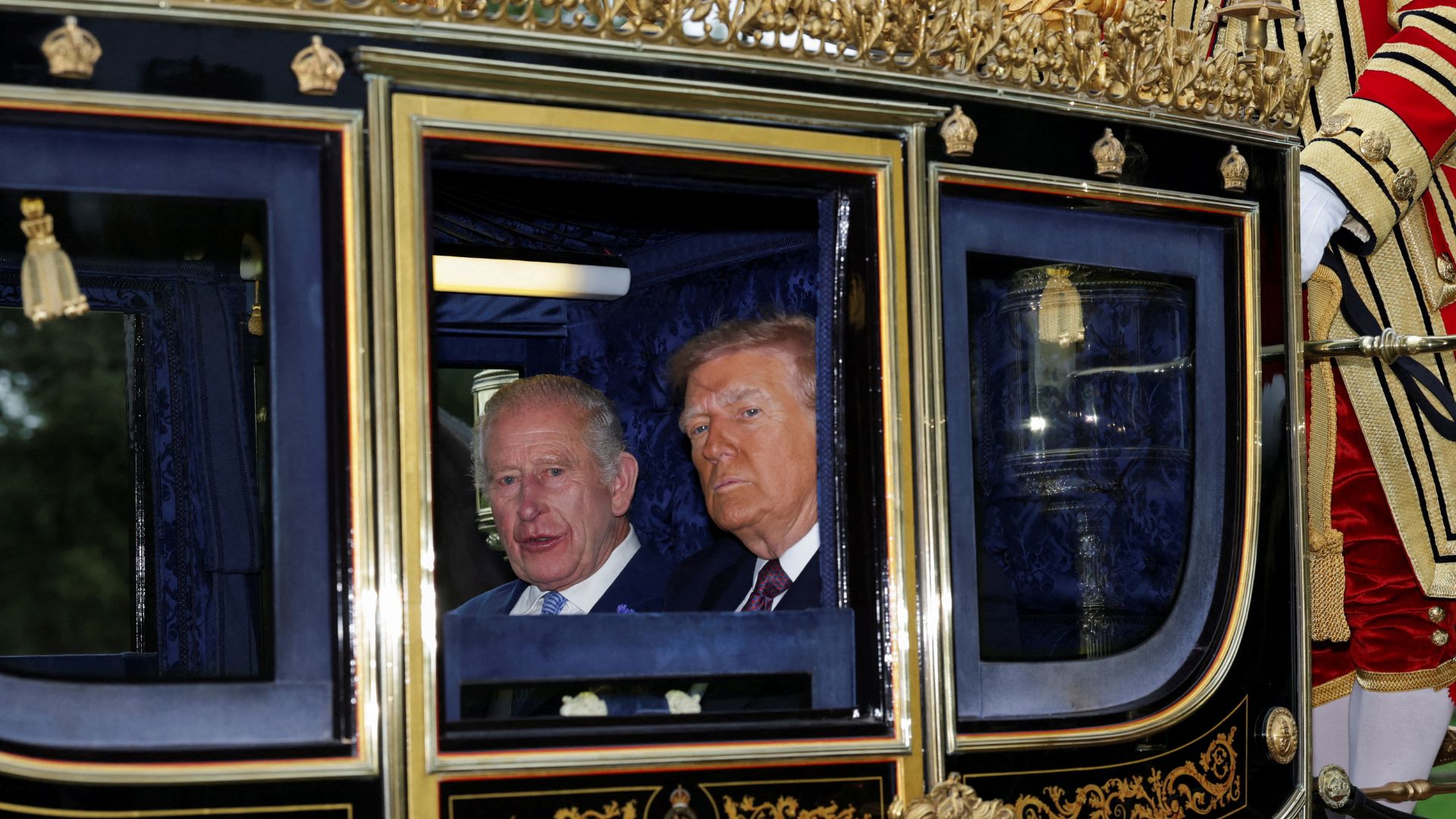 Britain's King Charles and U.S. President Donald Trump sit in a carriage during a procession through Windsor Castle. /Toby Melville/Pool 
