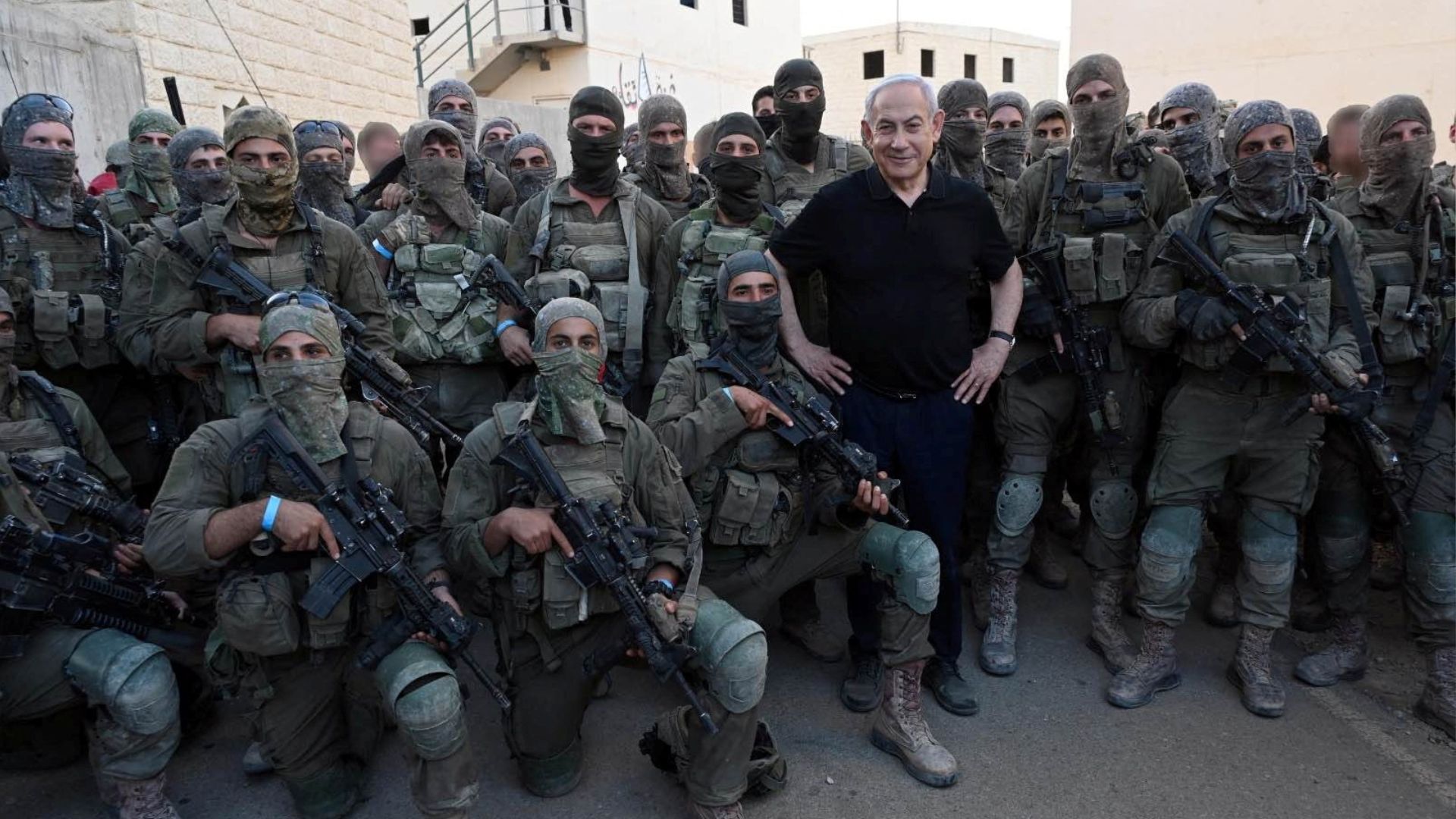 Israeli Prime Minister Benjamin Netanyahu with soldiers on a visit to an army base in Tze'elim in 2023. /Israeli Government Press Office