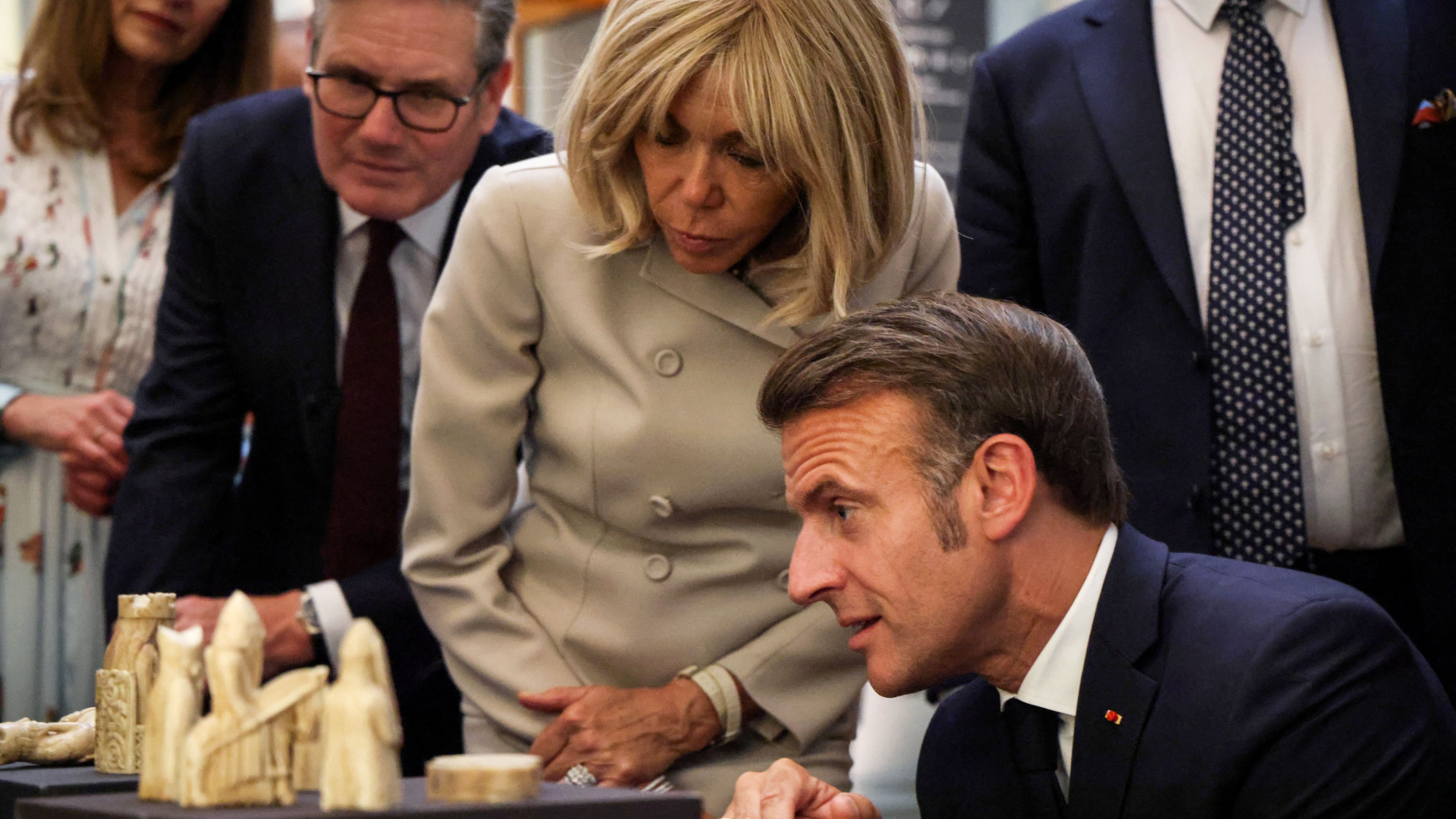 UK Prime Minister Keir Starmer and French President Emmanuel Macron in London in July, look at the Lewis chessmen which will be loaned to France in return for the Bayeux Tapestry. /Ludovic Marin/Reuters