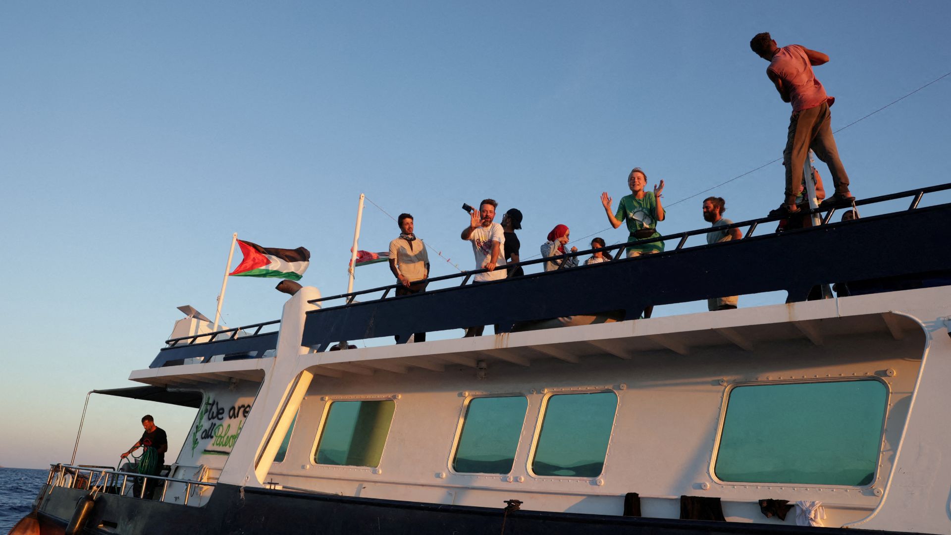 Greta Thunberg and members of the crew react aboard a ship, part of the Global Sumud Flotilla, as they sail off Crete island on September 25. /Stefanos Rapanis/Reuters/File