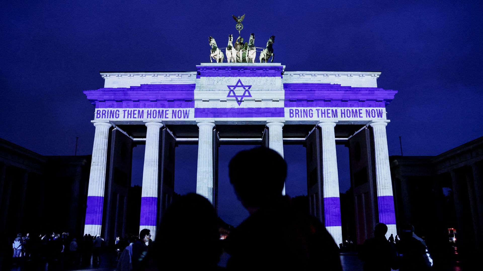 The Brandenburg Gate is lit up with the words 'Bring them home now', a reference to the Israelis taken hostage during the deadly October 7, 2023 attack on Israel by Hamas from Gaza, on its two-year anniversary, in Berlin. /Nadja Wohlleben/Reuters
