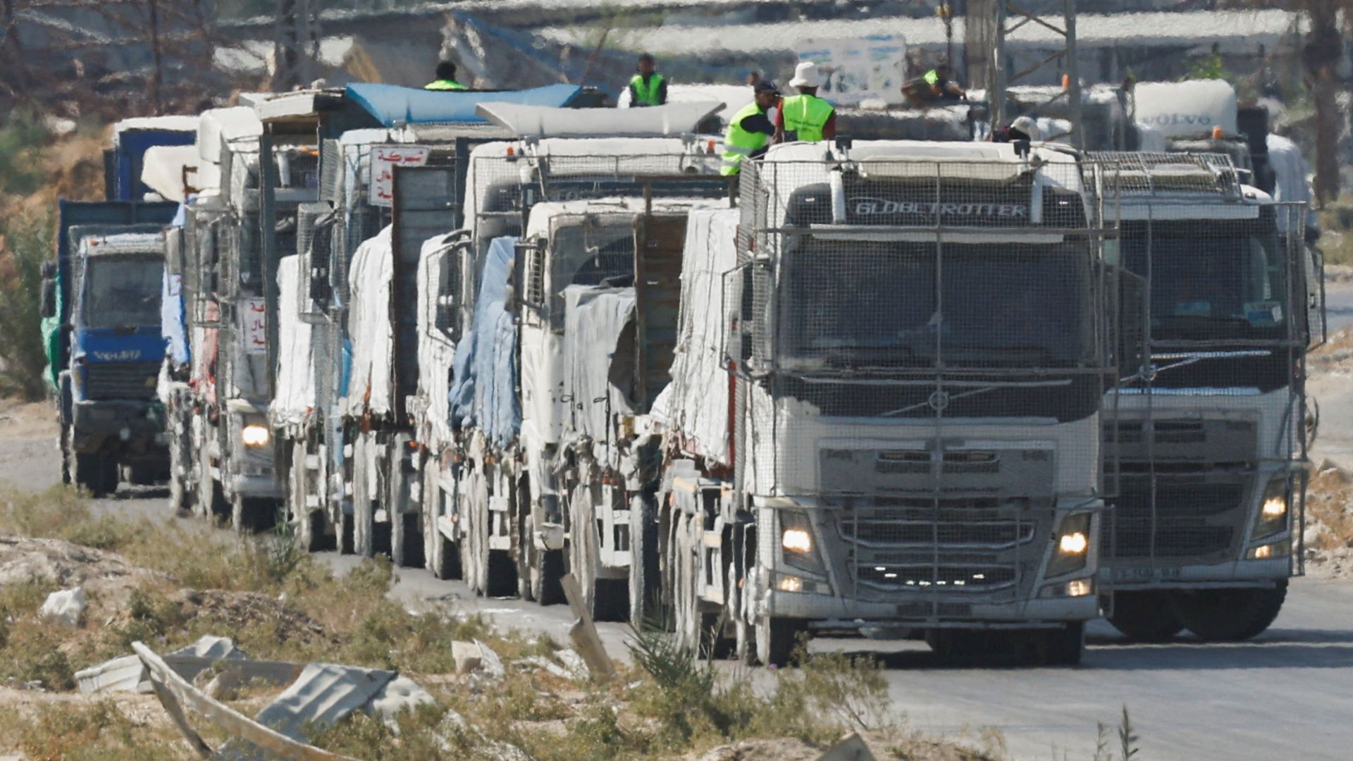 Trucks carry aid for Palestinians in Khan Younis, on October 17. /Mahmoud Issa/Reuters