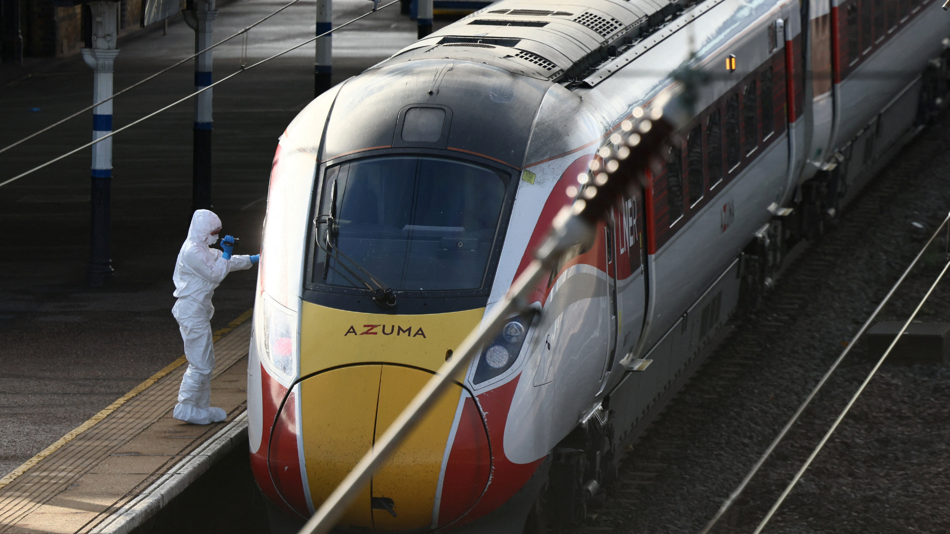 A forensic officer inspects the train where a series of stabbings took place on Saturday evening. /Jack Taylor/Reuters
