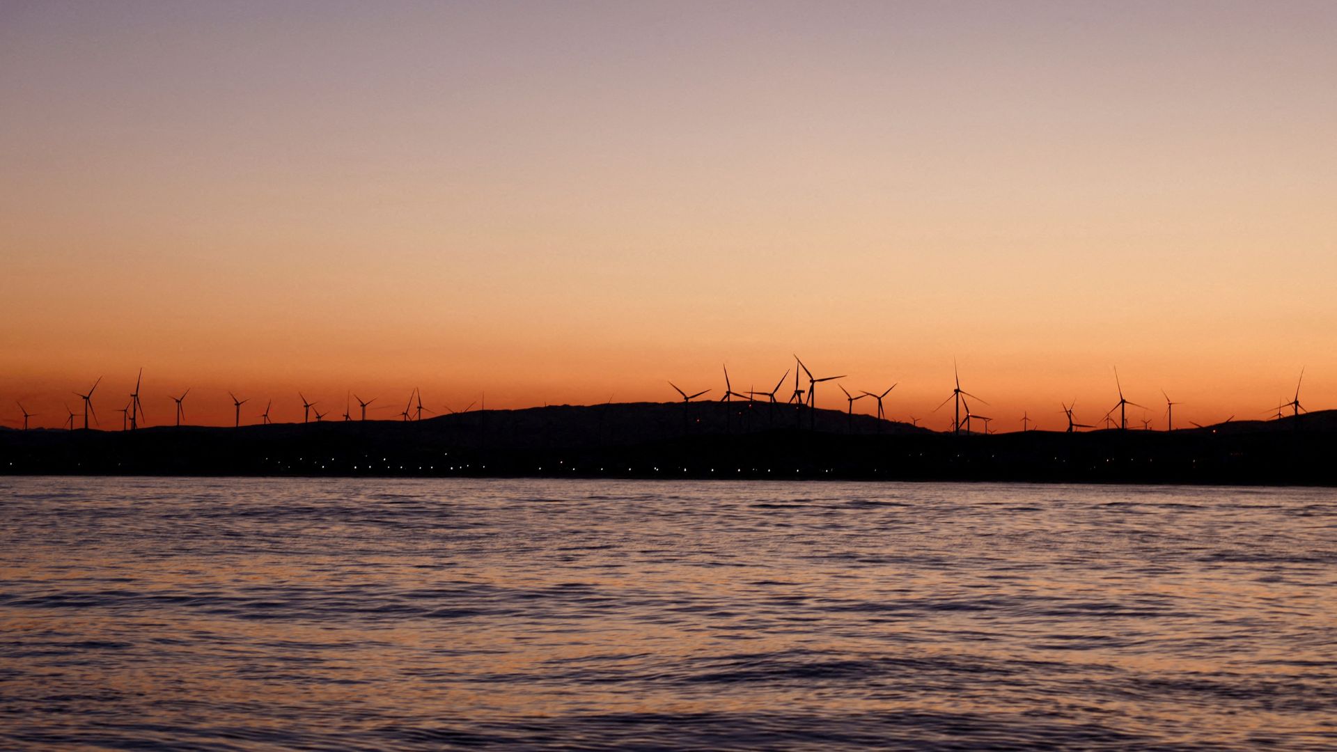 Wind turbines spin in front of the Atlantic Ocean near Zahara de los Atunes, Spain. /Nacho Doce/File/Reuters 
