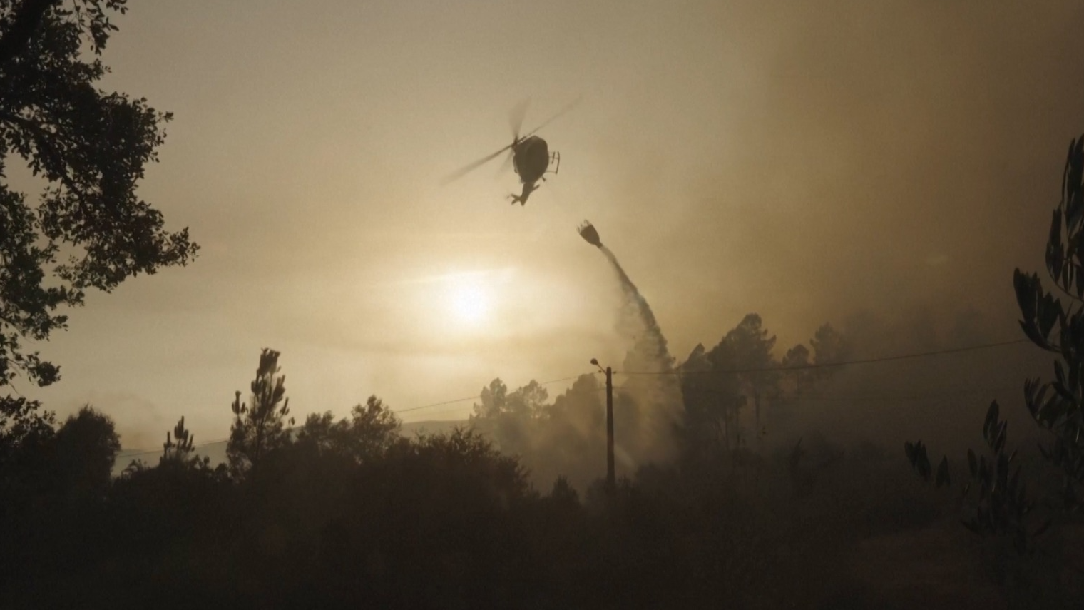 A helicopter dealing with fires in Spain last summer 2025 when a million acres burned. /CGTN