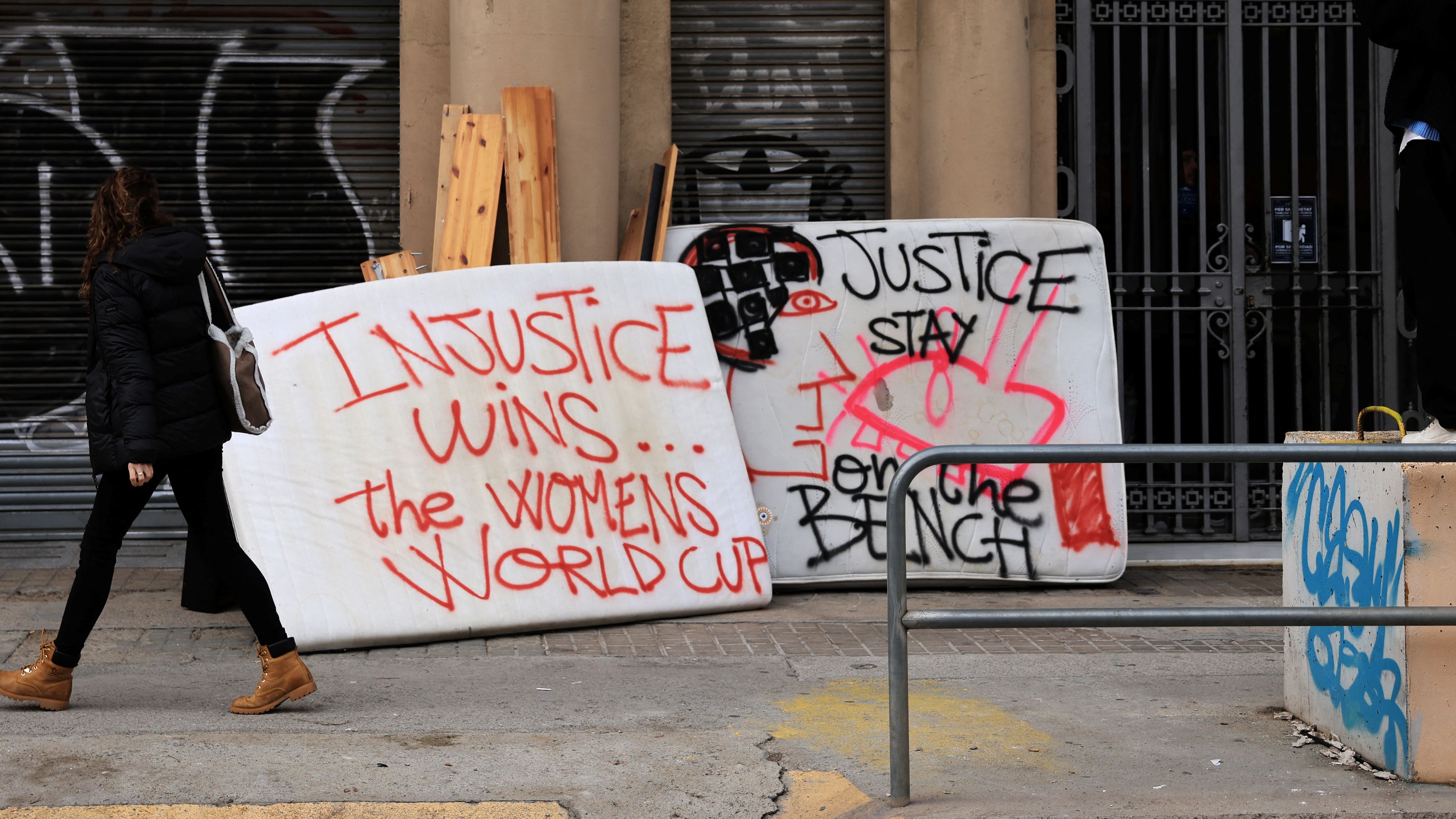 Graffiti painted on mattresses by a local artist in Barcelona in February condemning Rubiales. /Nacho Doce/Reuters