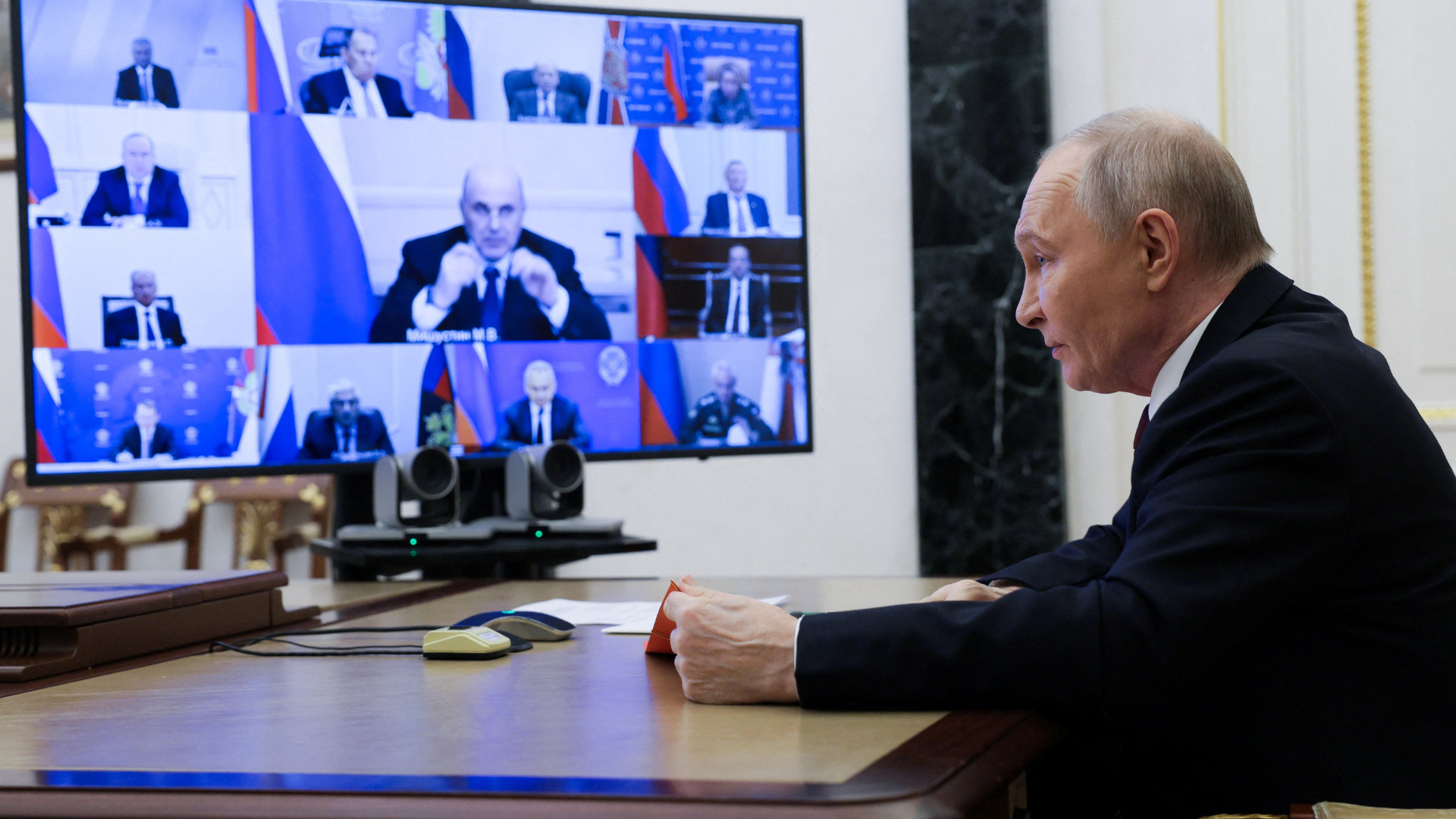 Russian President Vladimir Putin chairs a meeting with members of the Security Council via video link at the Kremlin in Moscow. Sputnik/Gavriil Grigorov/Pool/Reuters