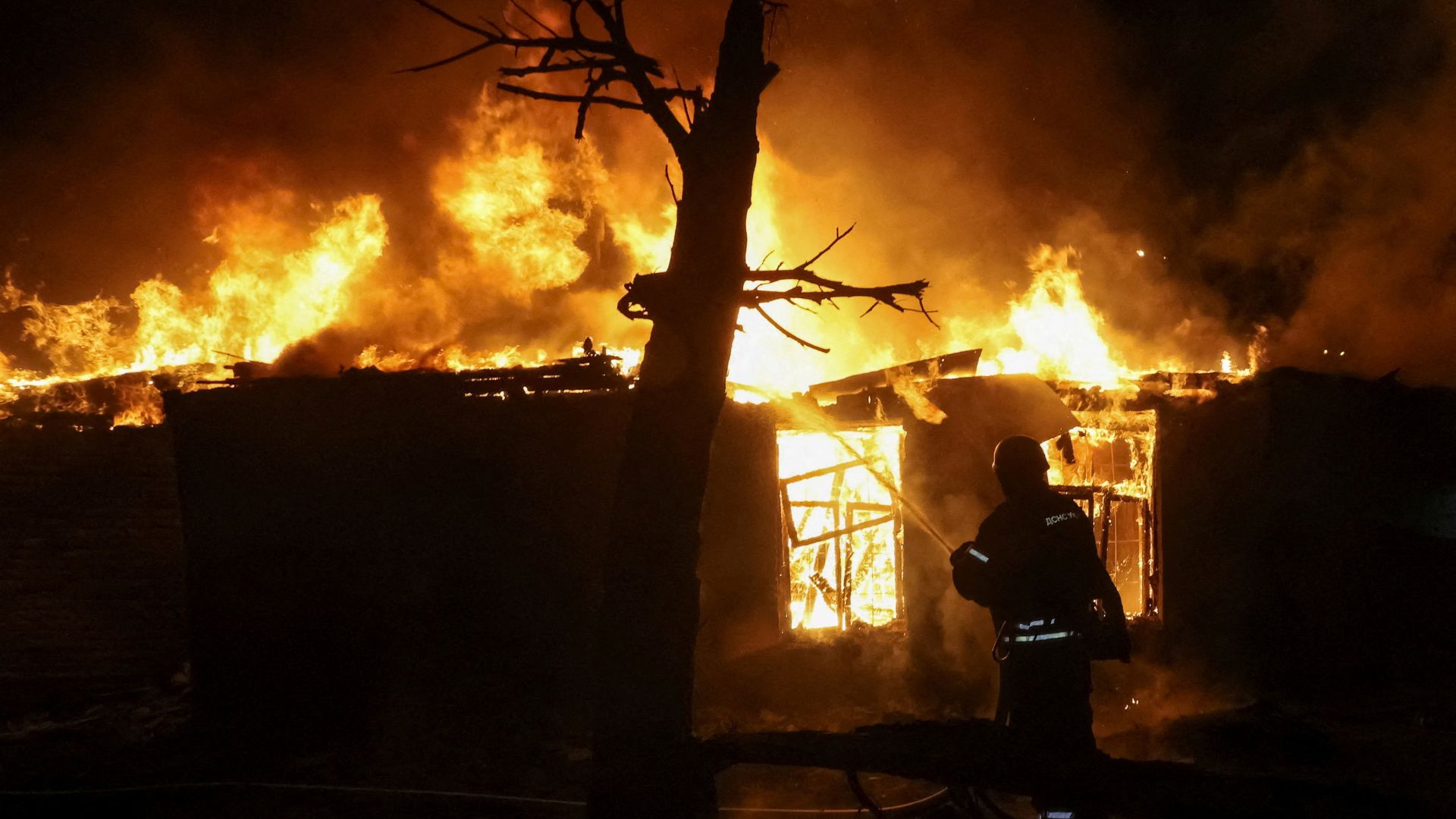 A firefighter at the site of a Russia drone strike in Kharkiv. /Vyacheslav Madiyevskyy/Reuters