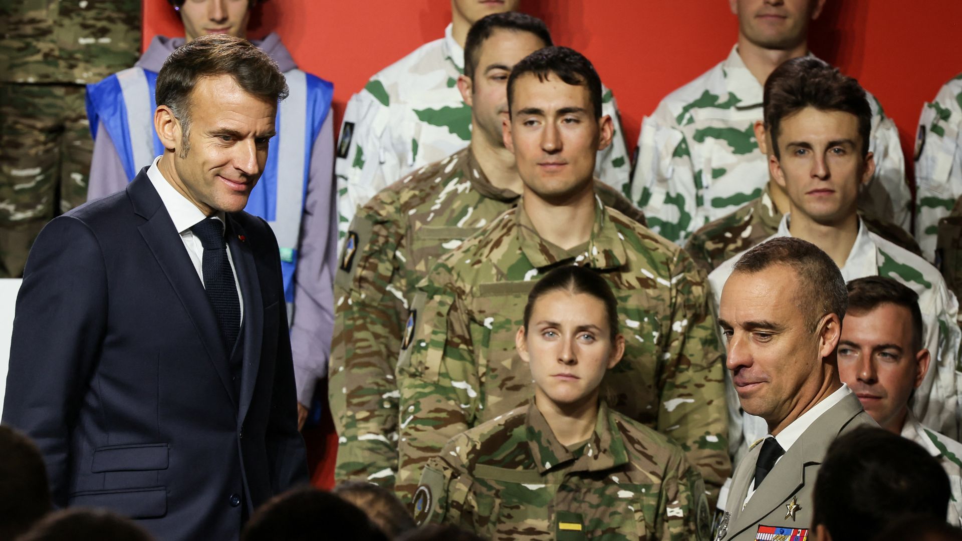France's President Emmanuel Macron meets soldiers after he unveiled a new national military service at the military base in Varce. /Thomas Padilla/Pool
