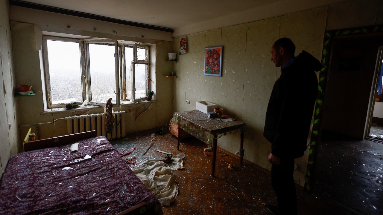 Oleksandr inspects his apartment damaged by Russian missile and drone strikes in Kyiv. REUTERS/Valentyn Ogirenko