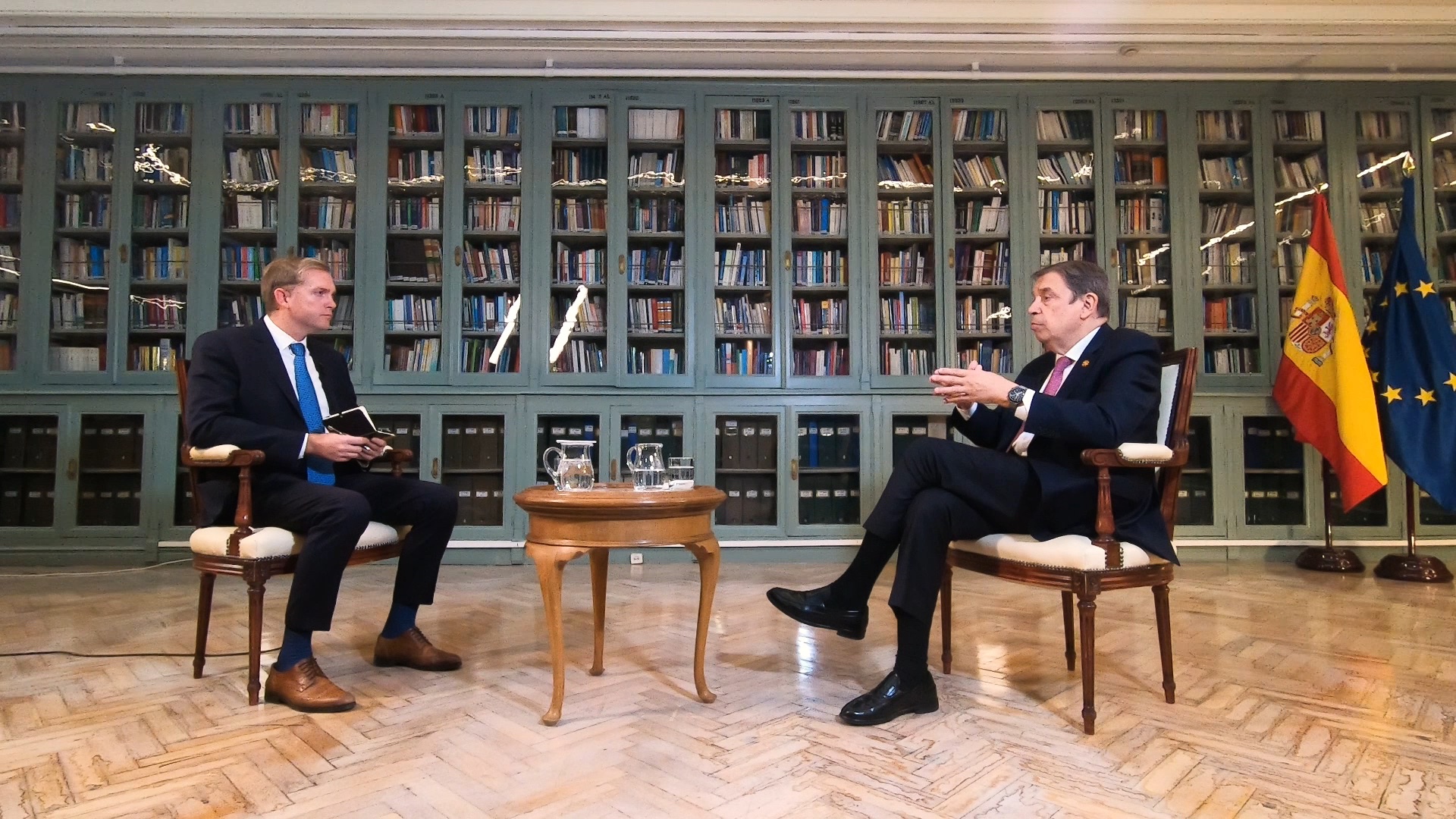 Agriculture Minister Luis Planas (R) talks to CGTN's Ken Browne. /CGTN