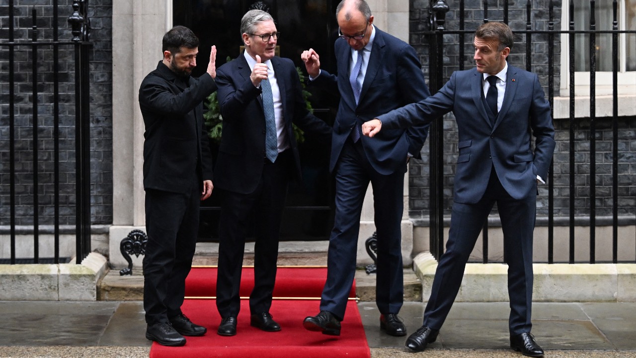 Ukraine's President Volodymyr Zelensky (L), Britain's Prime Minister Keir Starmer (2nd L), Germany's Chancellor Friedrich Merz (2nd R) and France's President Emmanuel Macron (R) say goodbye outside Number 10 Downing Street following their talks in London. /Chris J Ratcliffe/AFP
