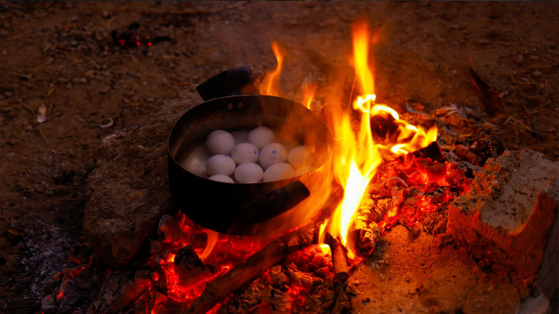 Food being prepared over a campfire in Ciudad Juarez, Mexico. /Jose Luis Gonzalez/Reuters
