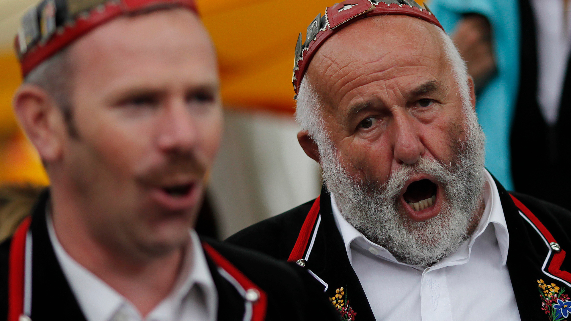 A group of yodellers dressed in traditional Swiss costumes make their way to the stage to perform at the 28th Federal Yodelling Festival in Interlaken. /Pascal Lauener/Reuters