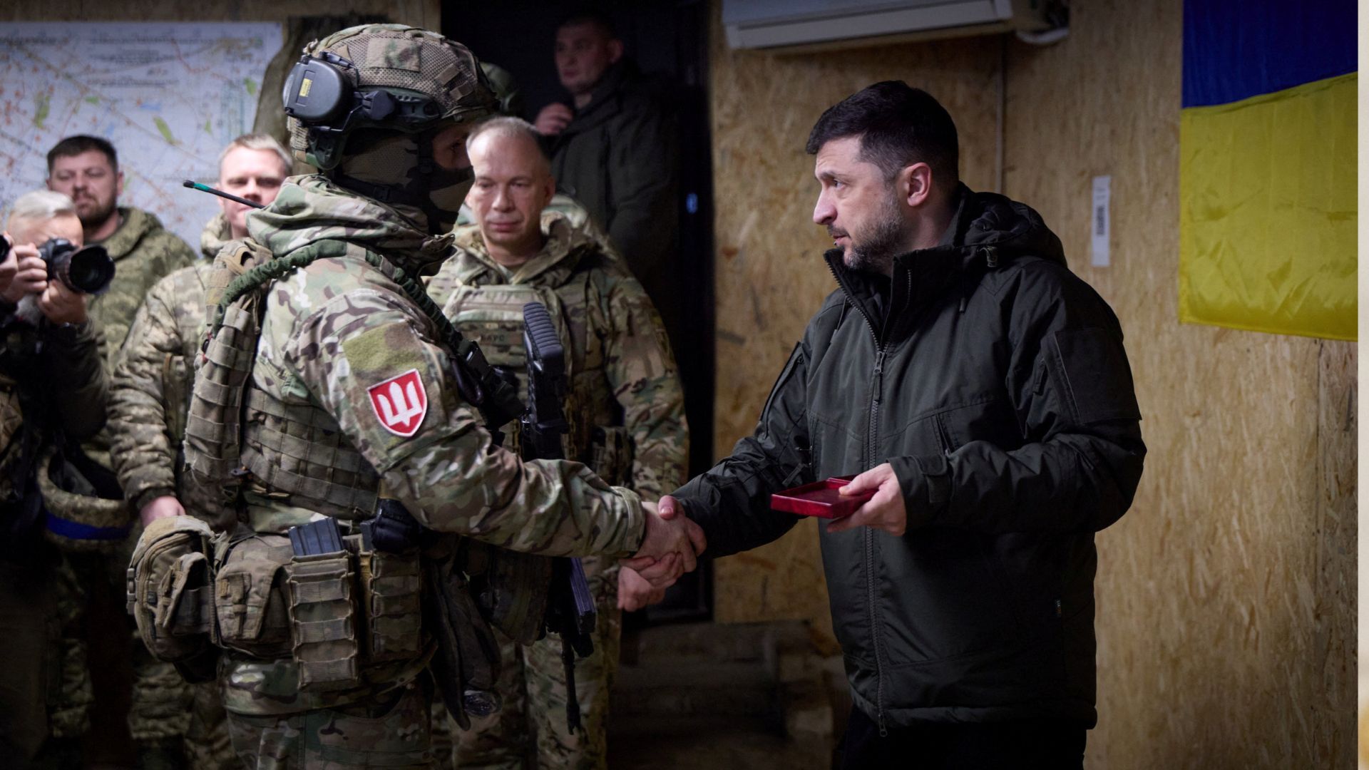 Ukraine's President Volodymyr Zelenskyy meets a serviceman during his visit to the frontline town of Kupiansk. /Ukrainian Presidential Press Service/Handout