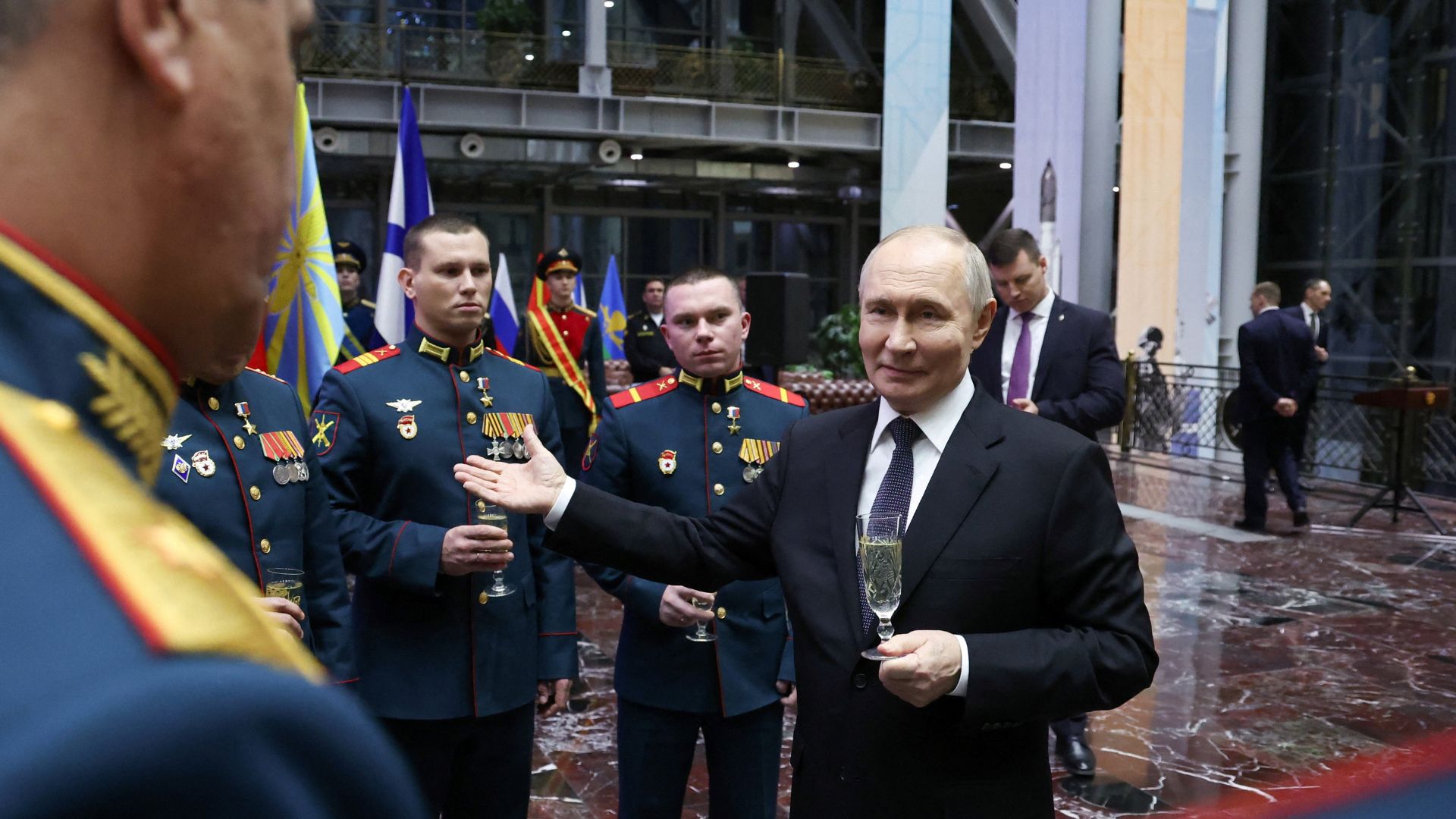 Russia's President Vladimir Putin takes part in a ceremony to present Gold Star medals to service members, who were involved in the country's military campaign in Ukraine and awarded the title of Hero of Russia, in Moscow on Wednesday. /Sputnik/Alexander Kazakov/Pool
