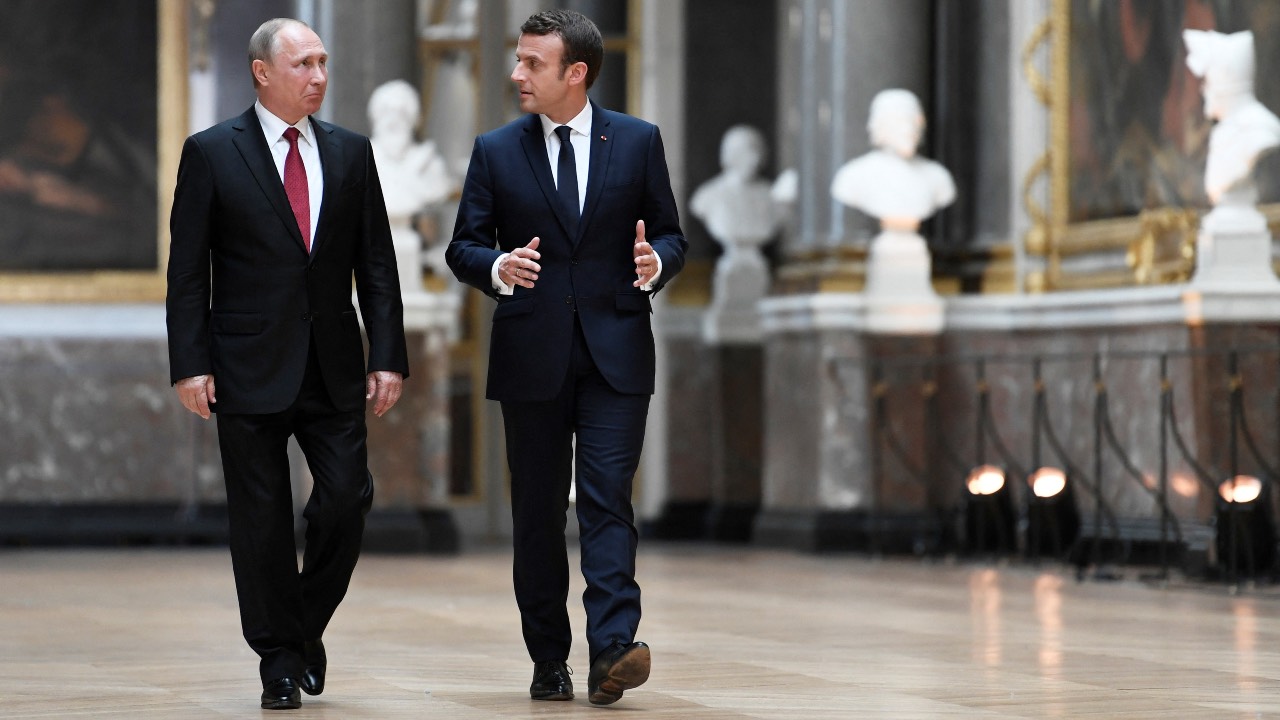 A file photos of France's President Emmanuel Macron (R) with Russia's President Vladimir Putin (L) in the Galerie des Batailles (Gallery of Battles).
Stephane De Sakutin/AFP