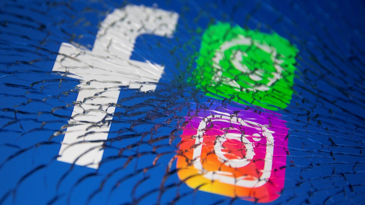 Facebook, Whatsapp and Instagram logos are displayed through broken glass in this illustration. /Dado Ruvic/Reuters