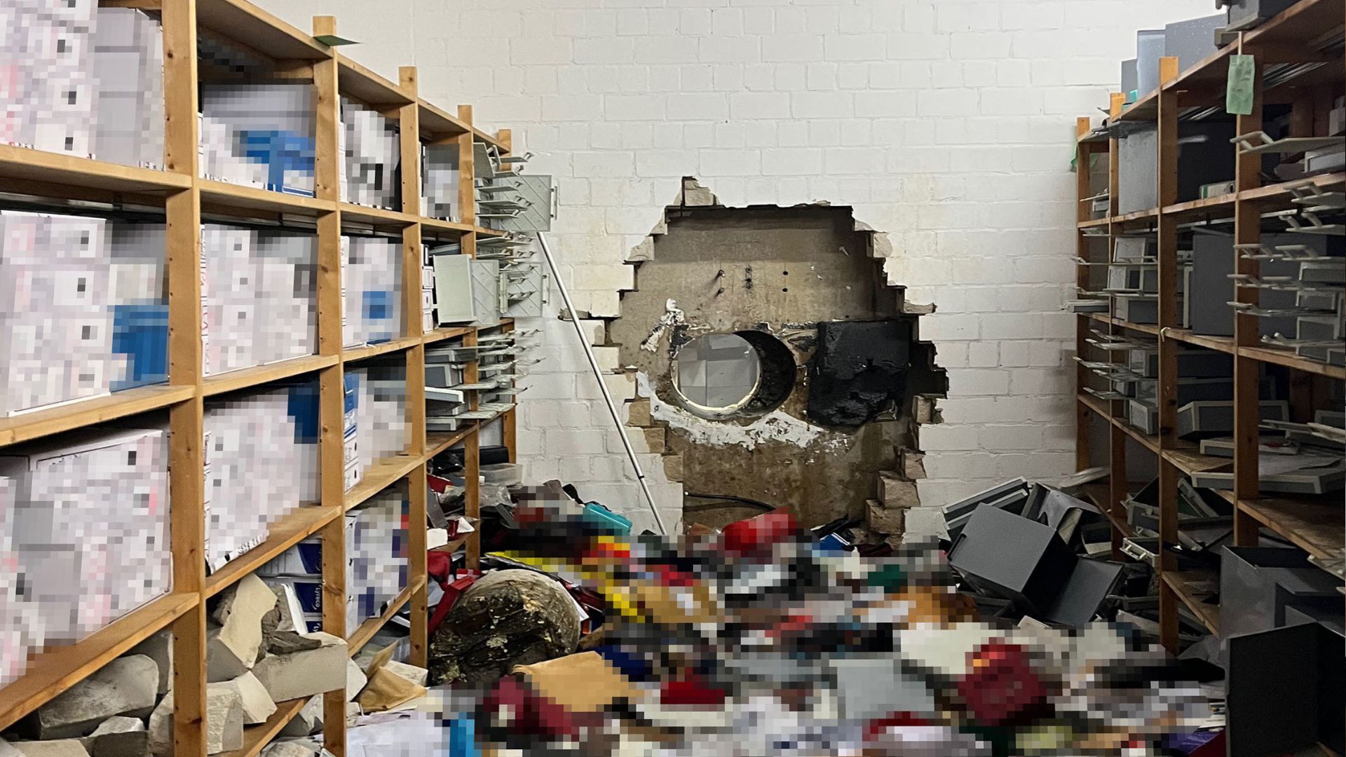 A giant hole in a wall of the bank vault of a Sparkasse bank branch after unknown perpetrators broke in during the Christmas holidays. /Handout/Police Gelsenkirchen
